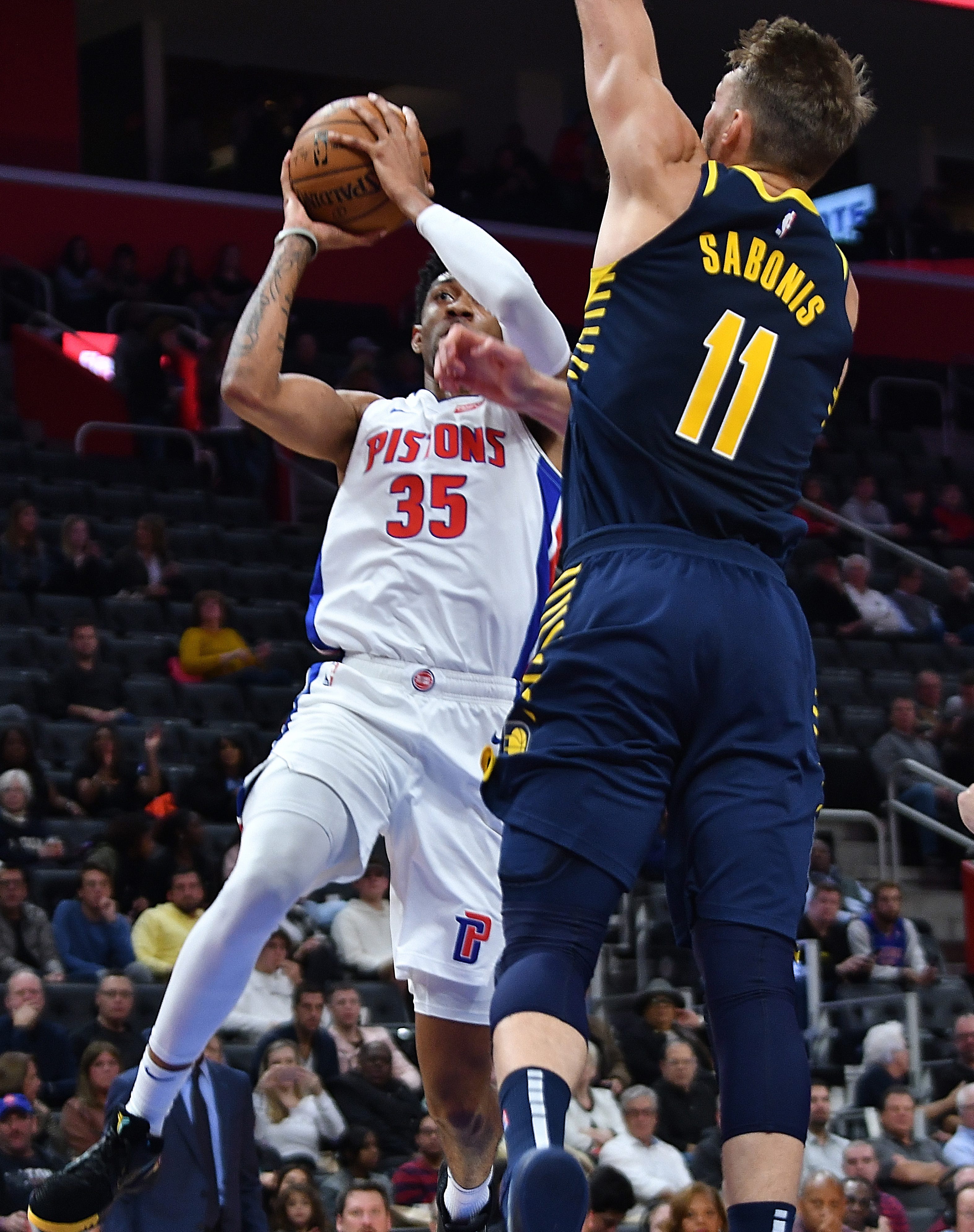 Pistons' Christian Wood scores over Pacers' Domantas Sabonis in the second quarter.