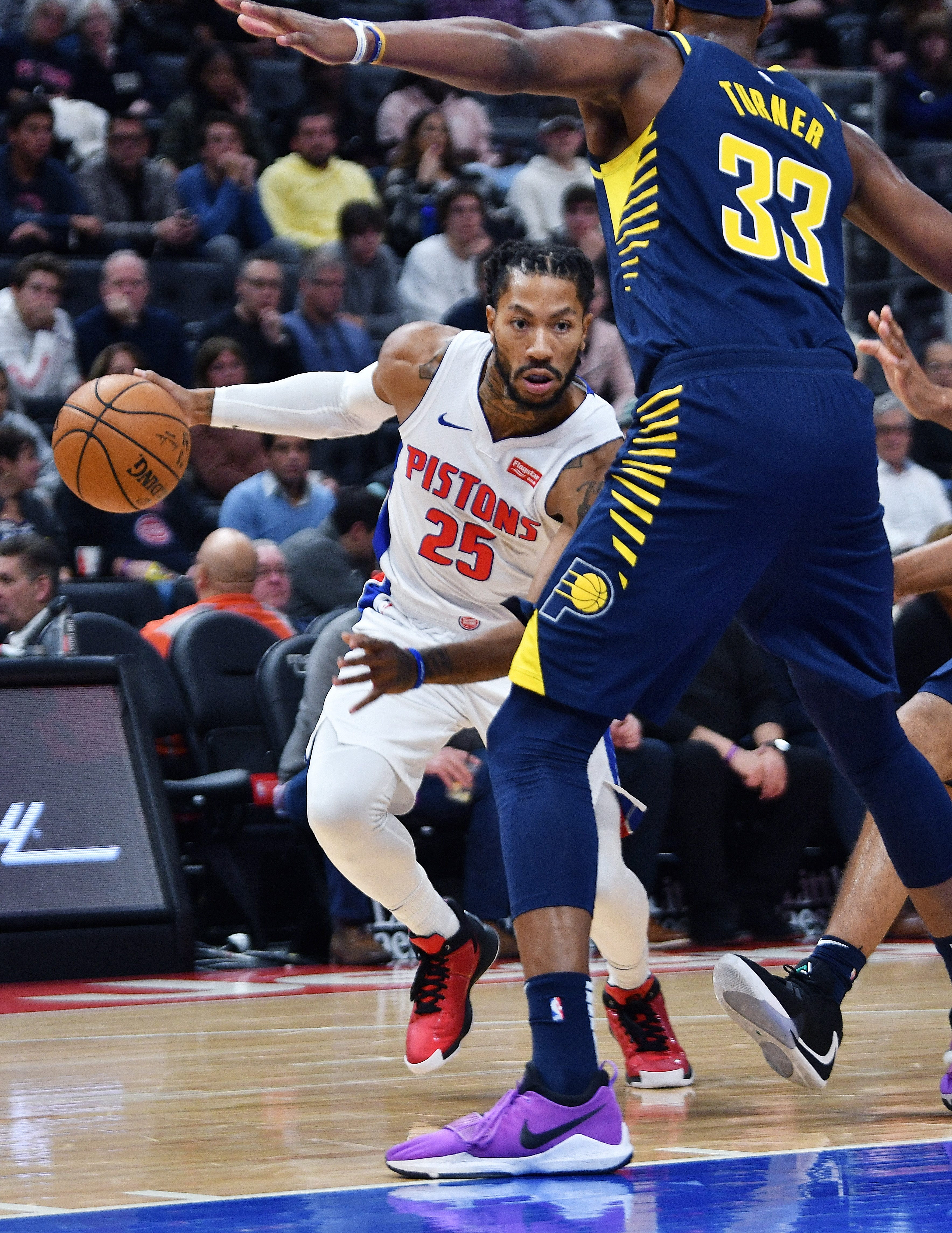 Pistons' Derrick Rose drives around Pacers' Myles Turner in the second quarter.