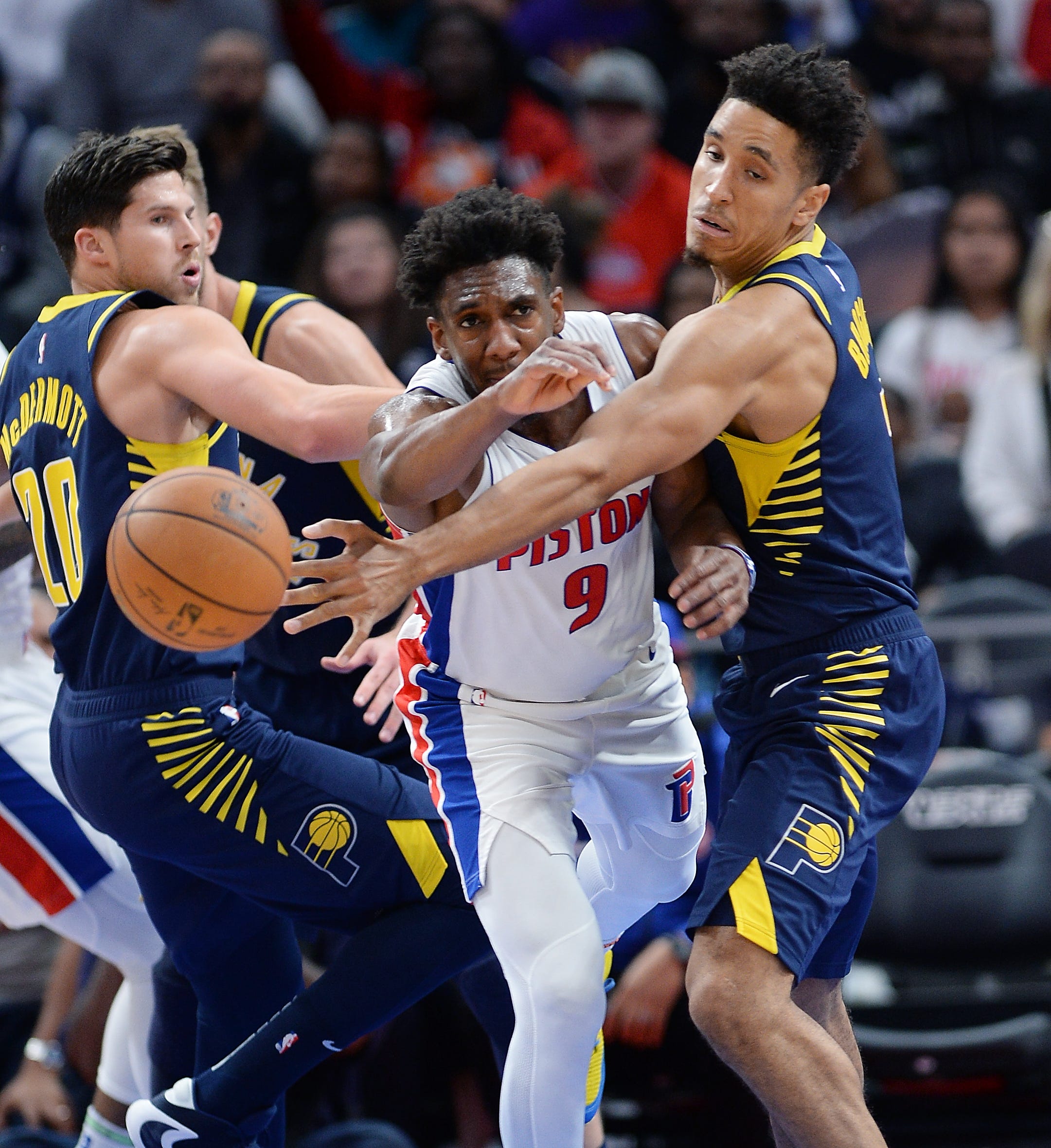Pistons' Langston Galloway, (9), and Pacers' Malcolm Brogdon fight for a loose ball in the fourth quarter.