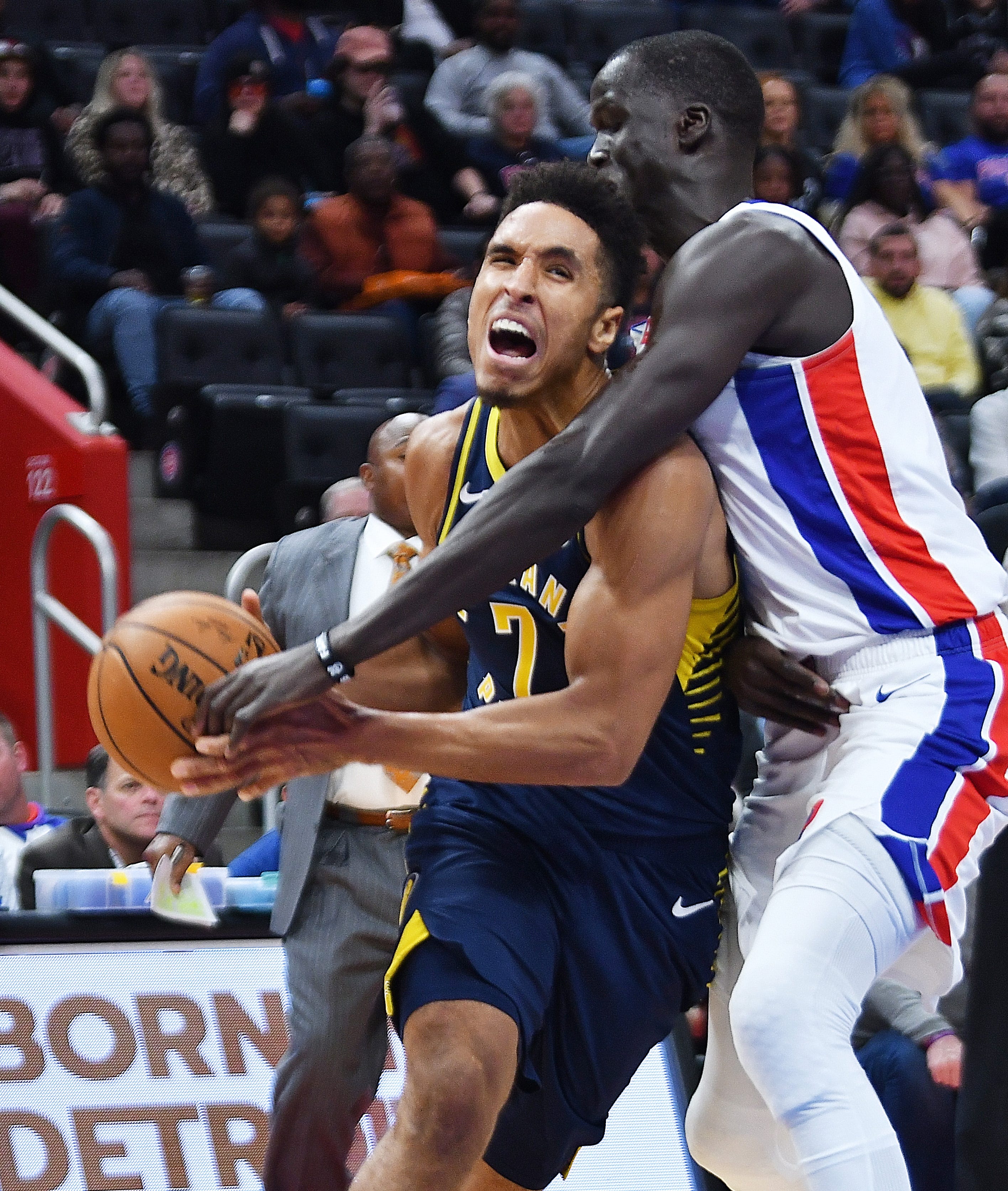 Pistons' Thon Maker defends the Pacers' Malcolm Brogdon in the third quarter.