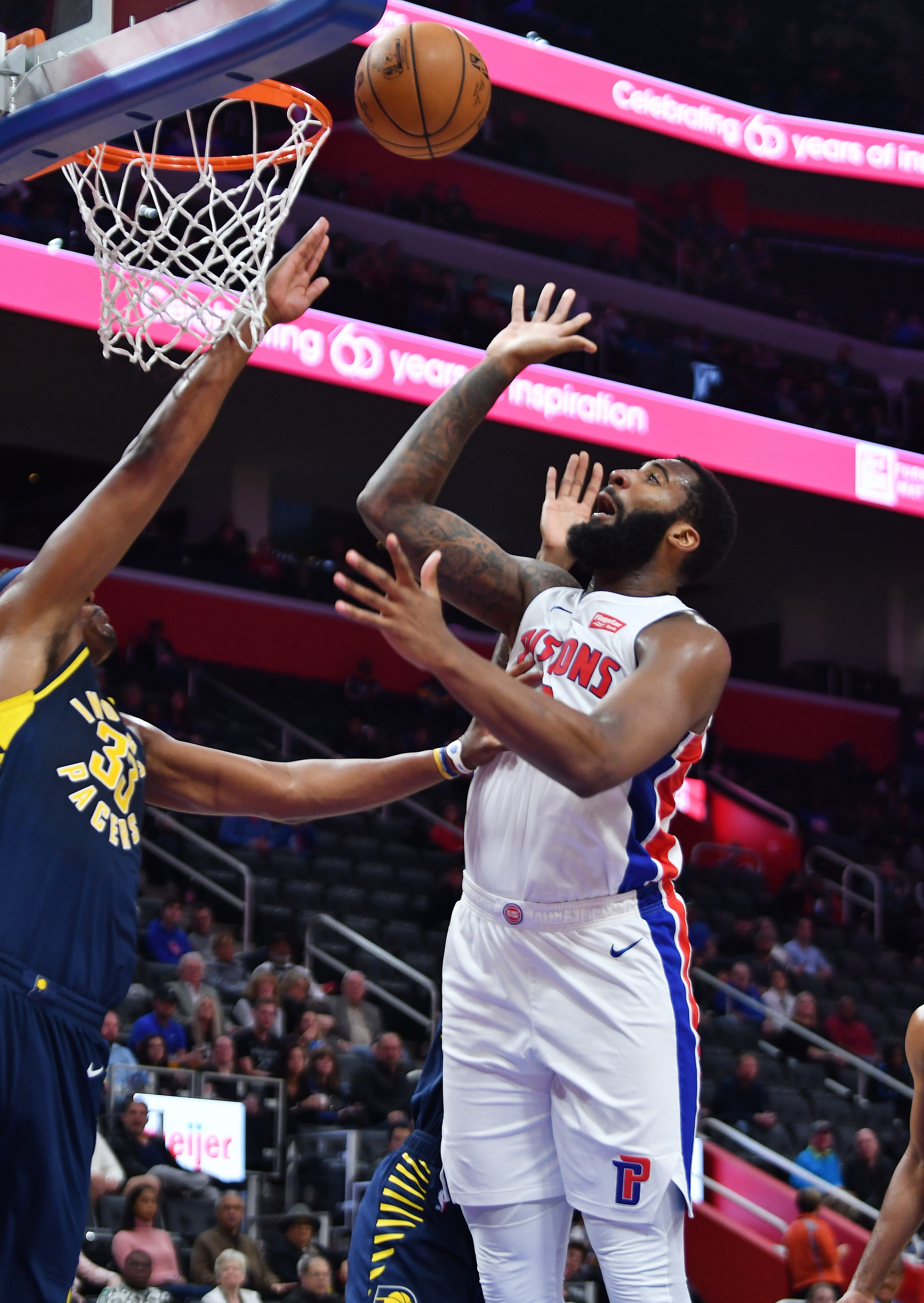Pistons' Andre Drummond scores over Pacers' Myles Turner in the second quarter.