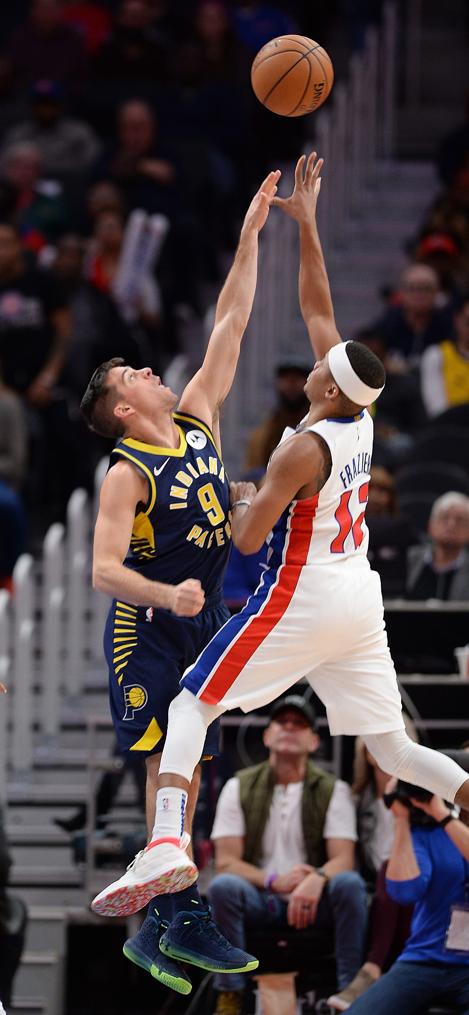 Pistons' Tim Frazier shoots over Pacers' T. J. McConnell in the fourth quarter.