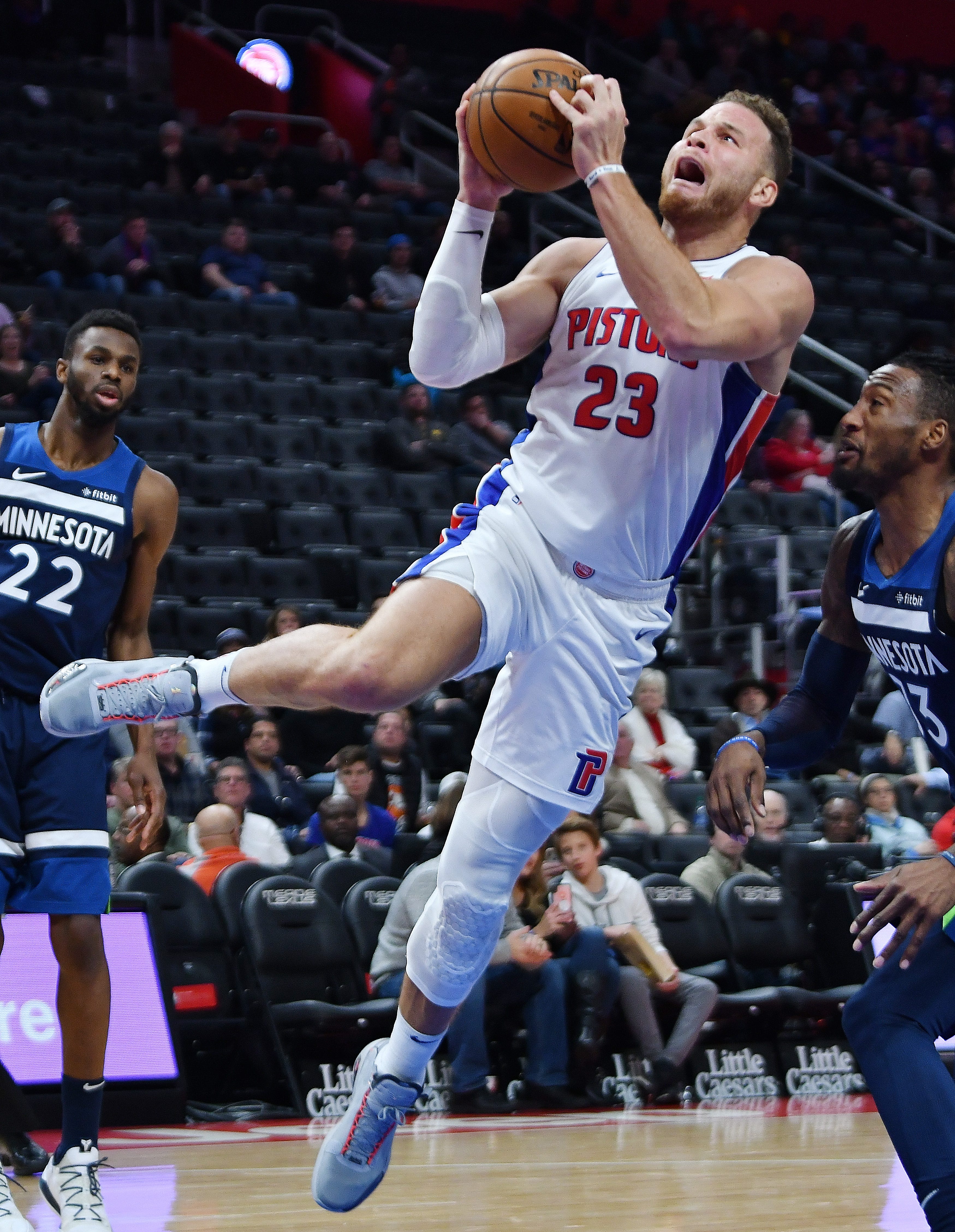 Pistons' Blake Griffin scores over Timberwolves' Robert Covington in the second quarter. Griffin had 19 points and seven rebounds.