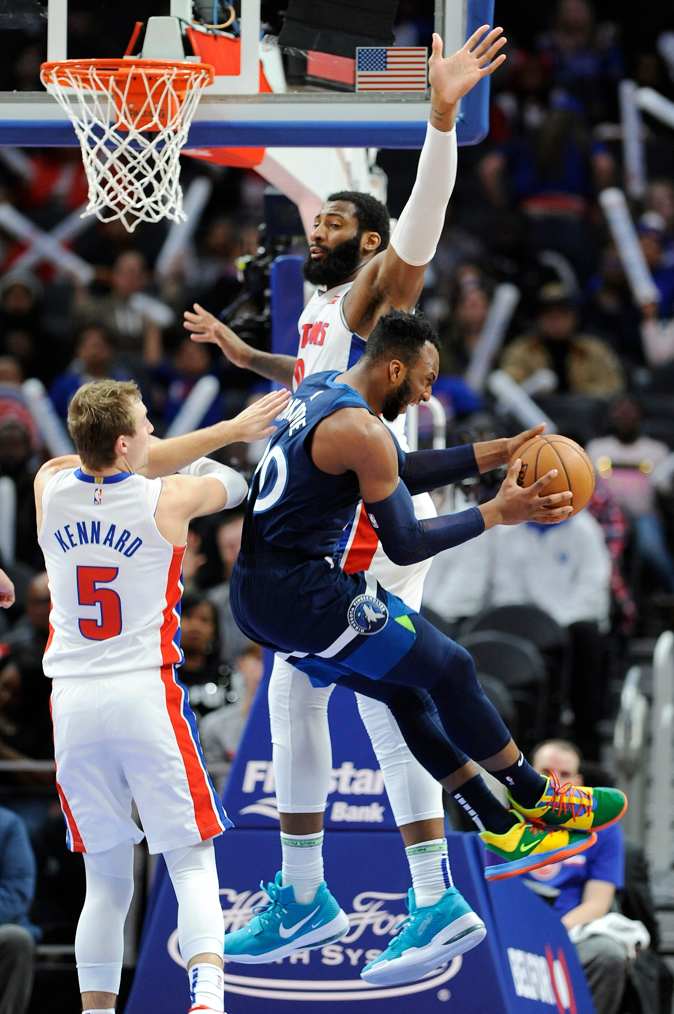 Pistons' Andre Drummond defends Timberwolves' Josh Okogie in the second quarter.