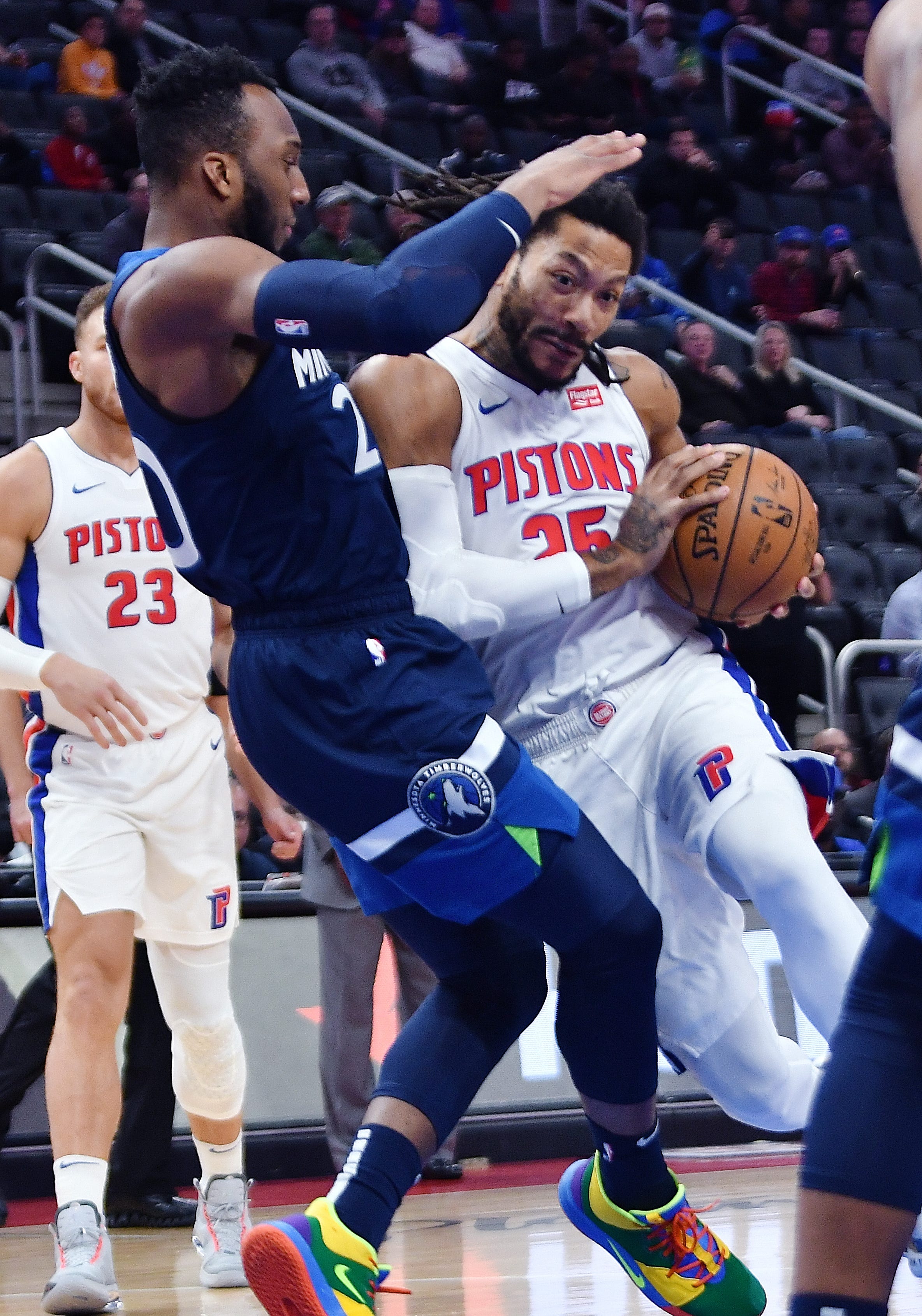 Pistons' Derrick Rose drives past Timberwolves' Josh Okogie in the first quarter. Rose had six points and five assists. The Timberwolves defeated the Pistons,120-114, Monday, November 11, 2019 at Little Caesars Arena in Detroit, Michigan.