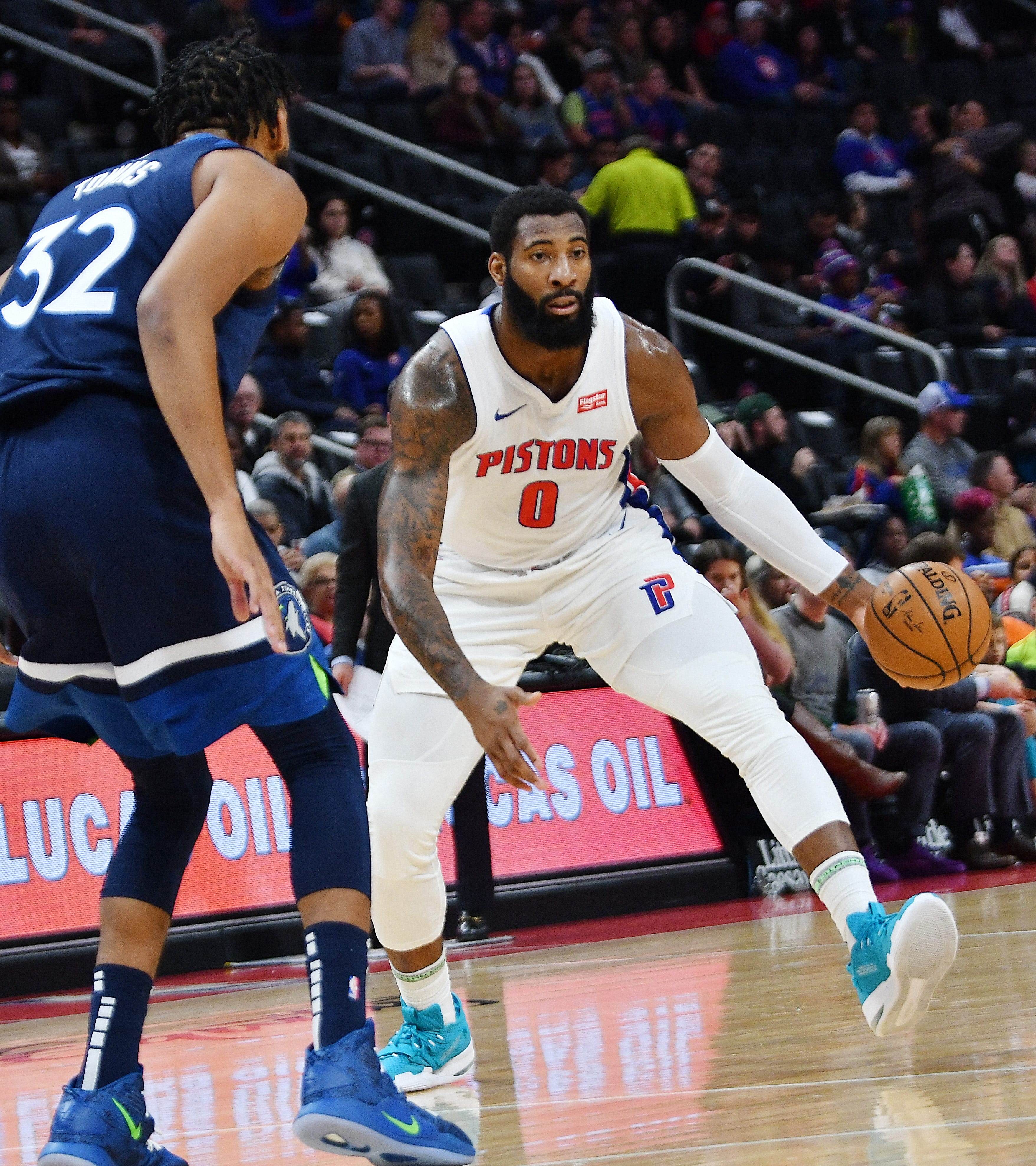 Pistons' Andre Drummond looks for room around Timberwolves' Karl-Anthony Towns in the first quarter.
