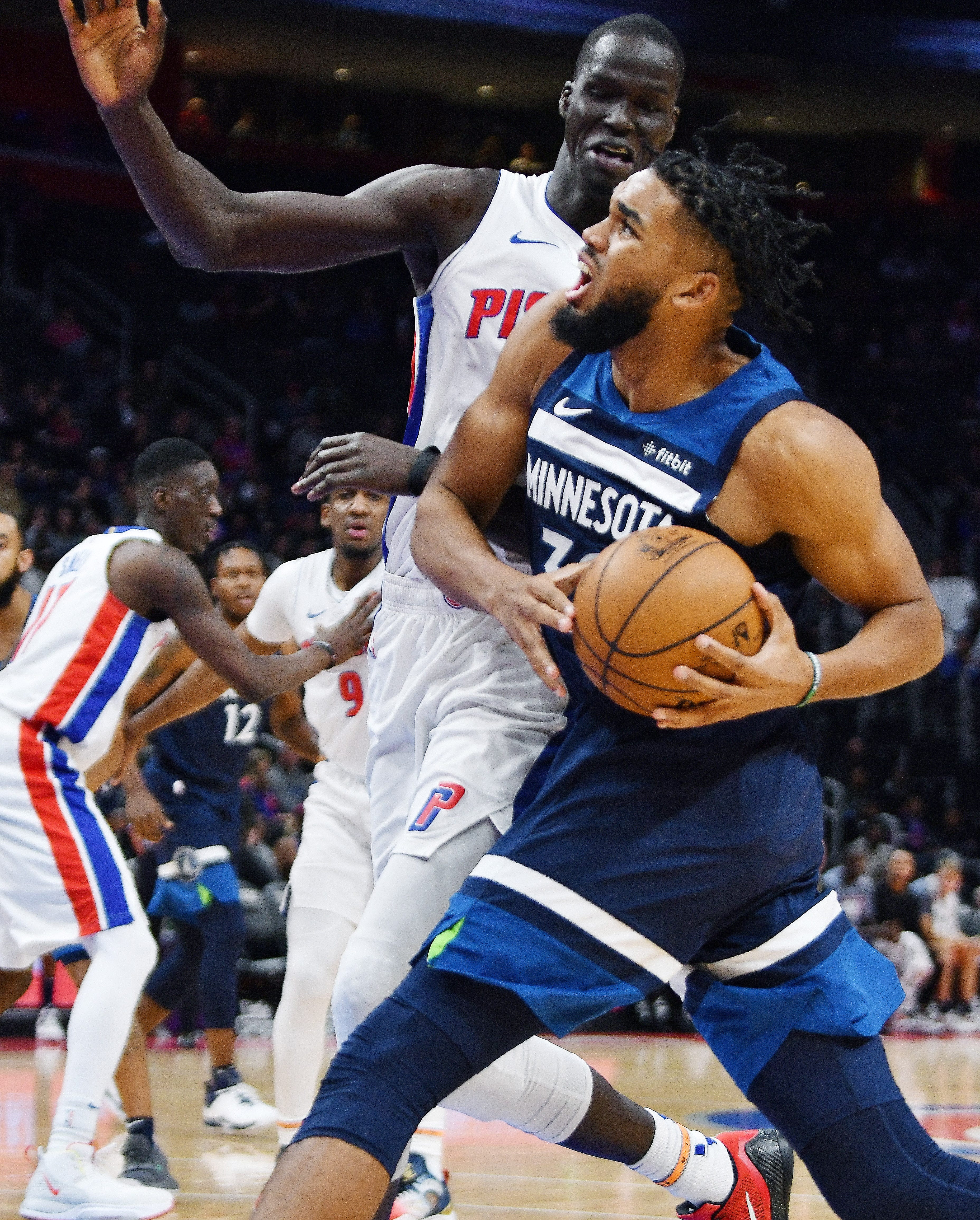 Timberwolves' Karl-Anthony Towns drives past Pistons' Thon Maker in the fourth quarter.
