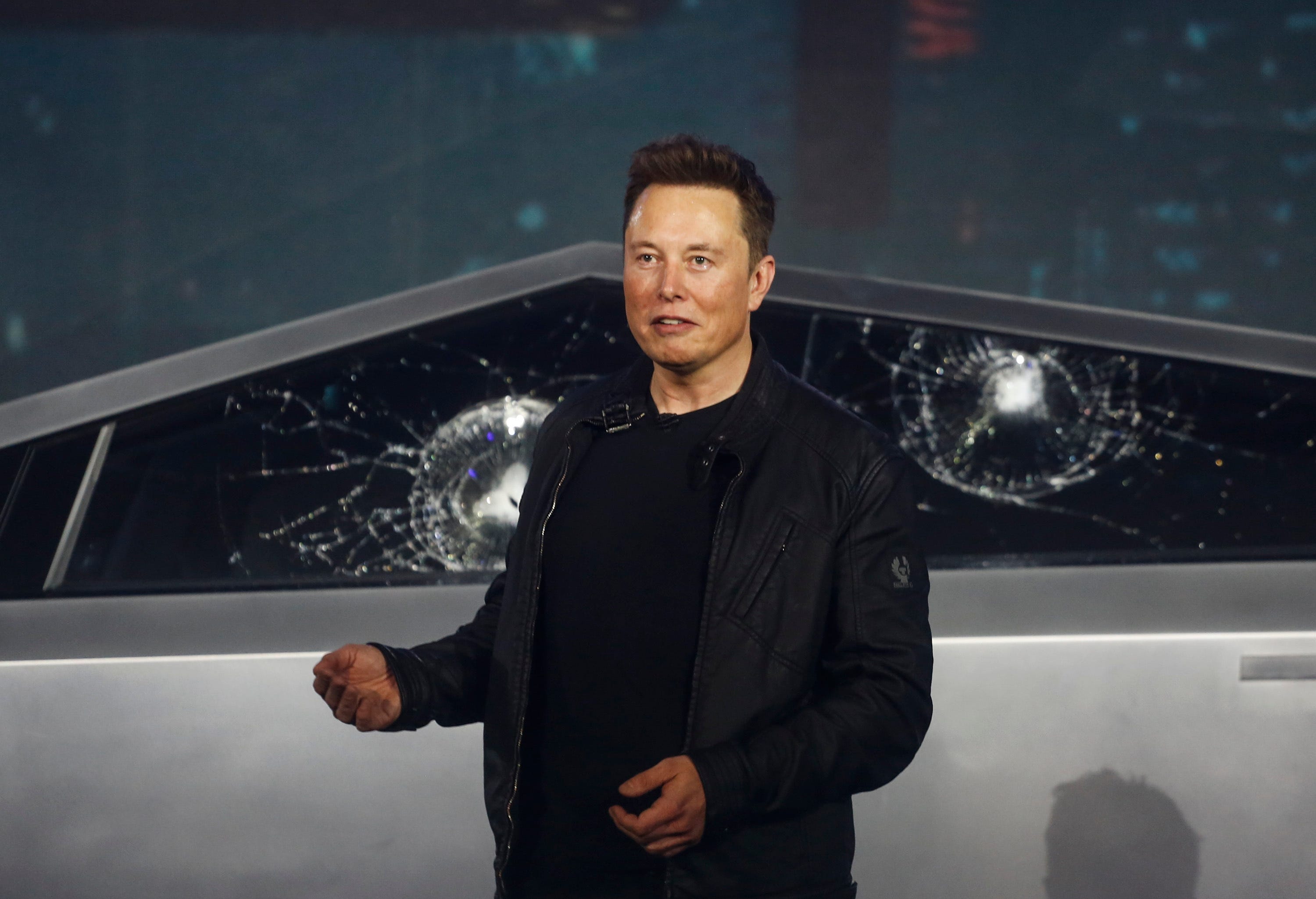 Tesla CEO Elon Musk introduces the Cybertruck at Tesla's design studio Thursday, Nov. 21, 2019, in Hawthorne, Calif. Musk is taking on the workhorse heavy pickup truck market with his latest electric vehicle.