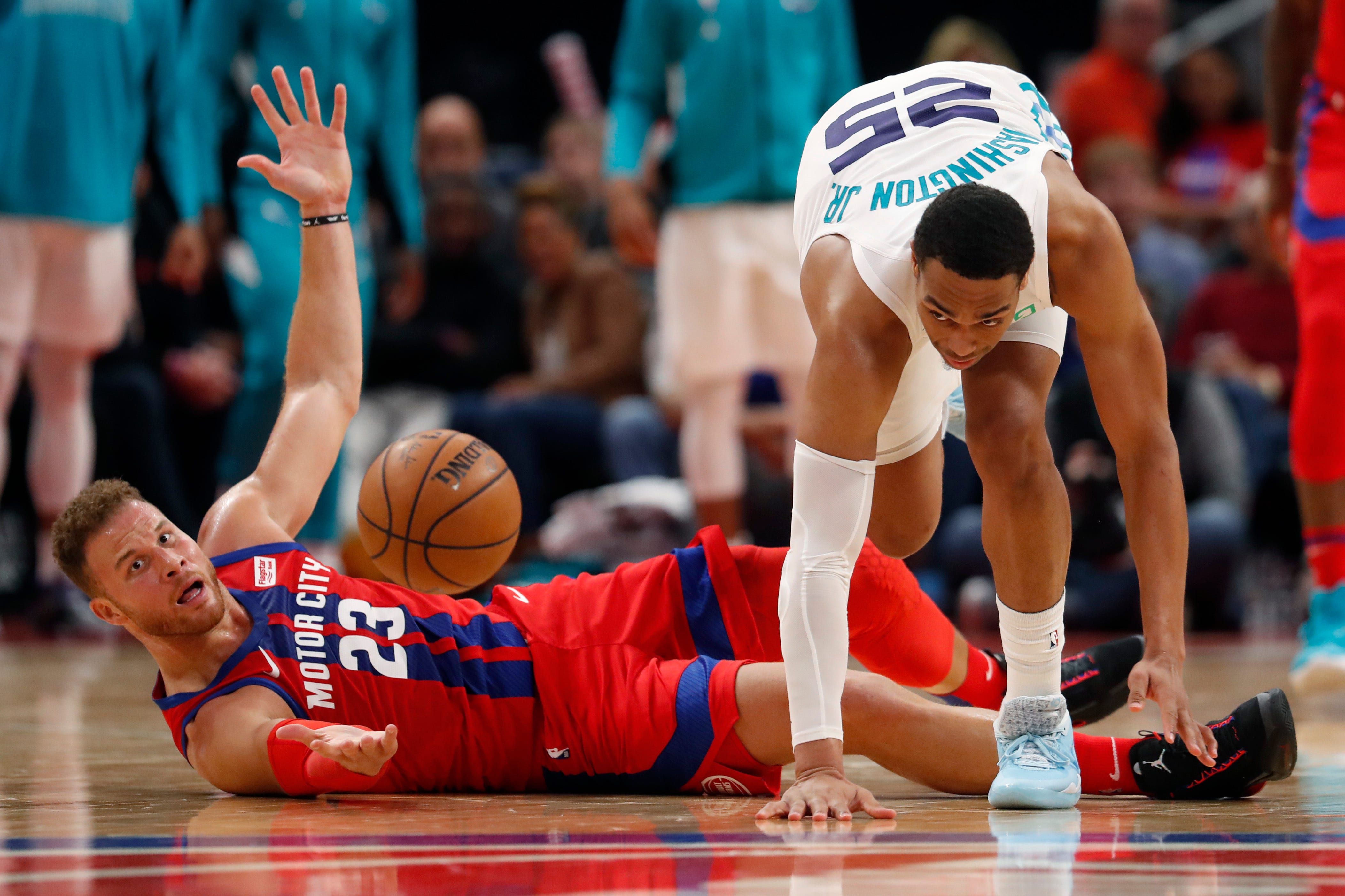 Pistons forward Blake Griffin looks on as Hornets forward PJ Washington chases the loose ball during the second half.
