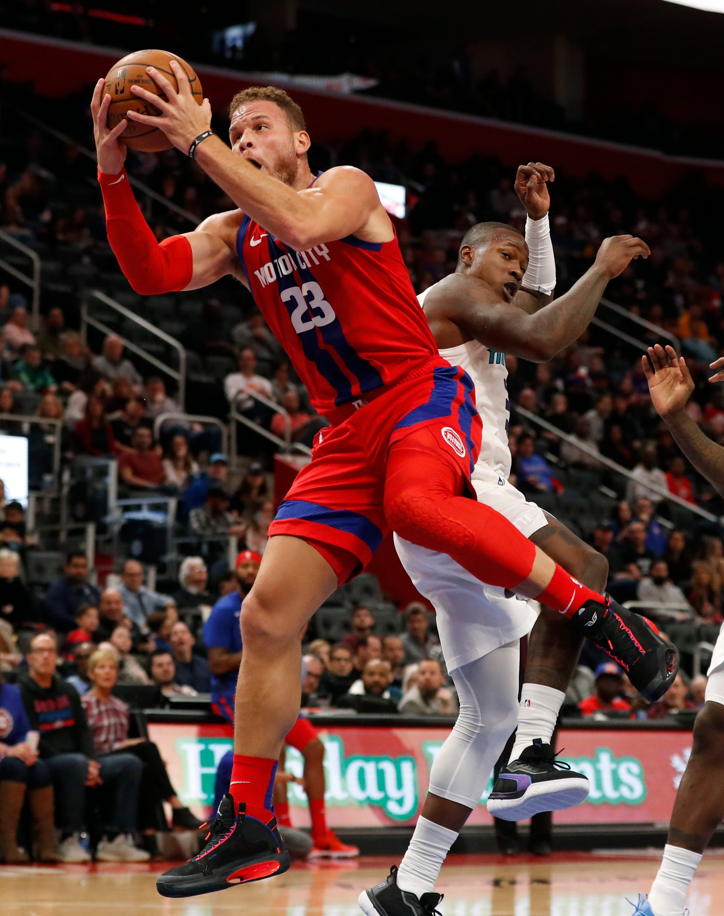 Pistons forward Blake Griffin reaches for a pass during the first half.