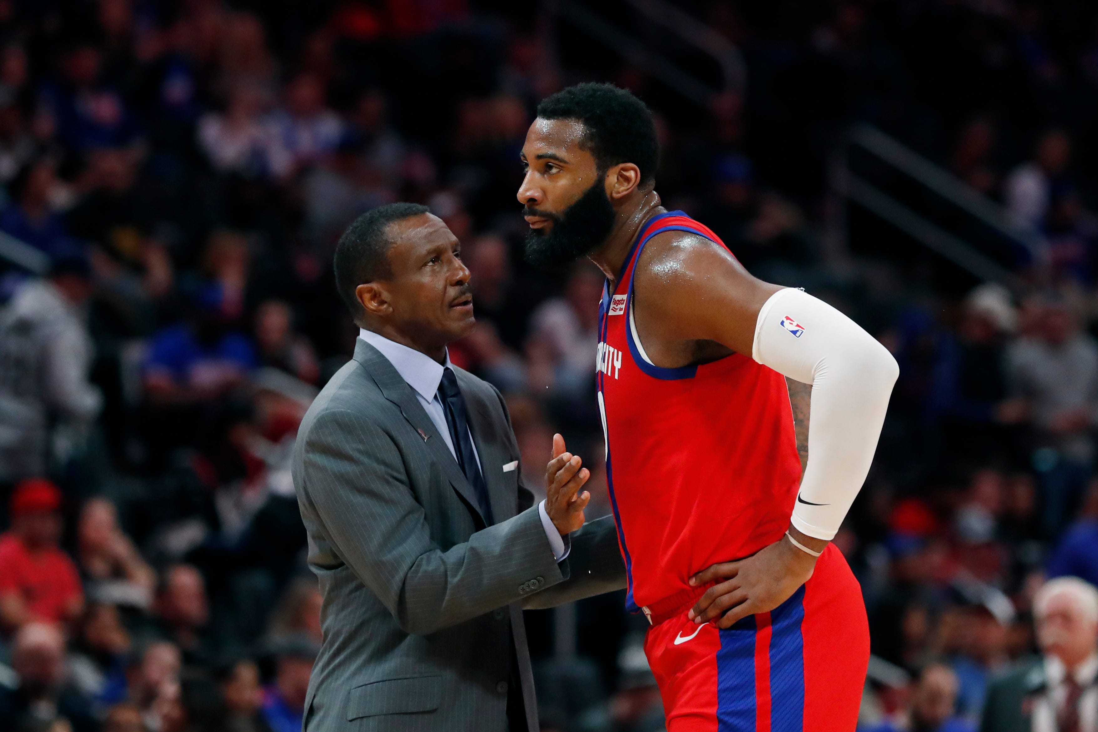Detroit Pistons head coach Dwane Casey talks with center Andre Drummond during the first half.