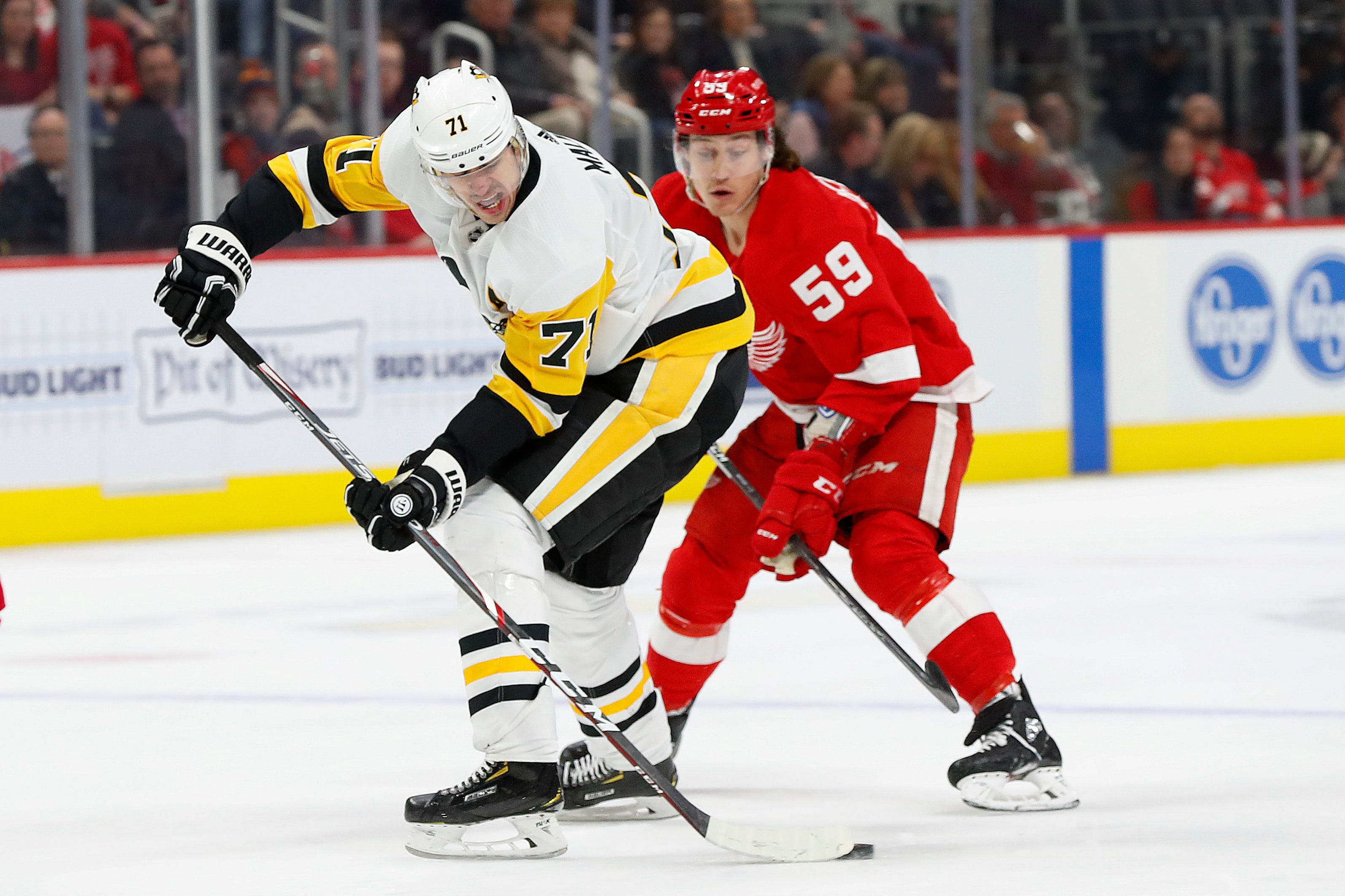 Pittsburgh Penguins center Evgeni Malkin (71) protects the puck from Detroit Red Wings left wing Tyler Bertuzzi (59) in the first period.