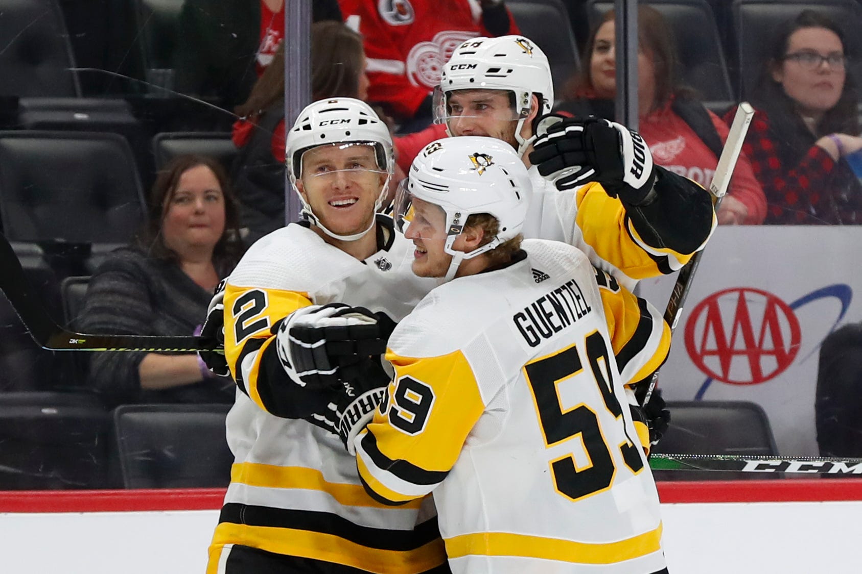 Pittsburgh Penguins defenseman Chad Ruhwedel (2) celebrates his goal with Marcus Pettersson (28) and Jake Guentzel (59) in the first period.