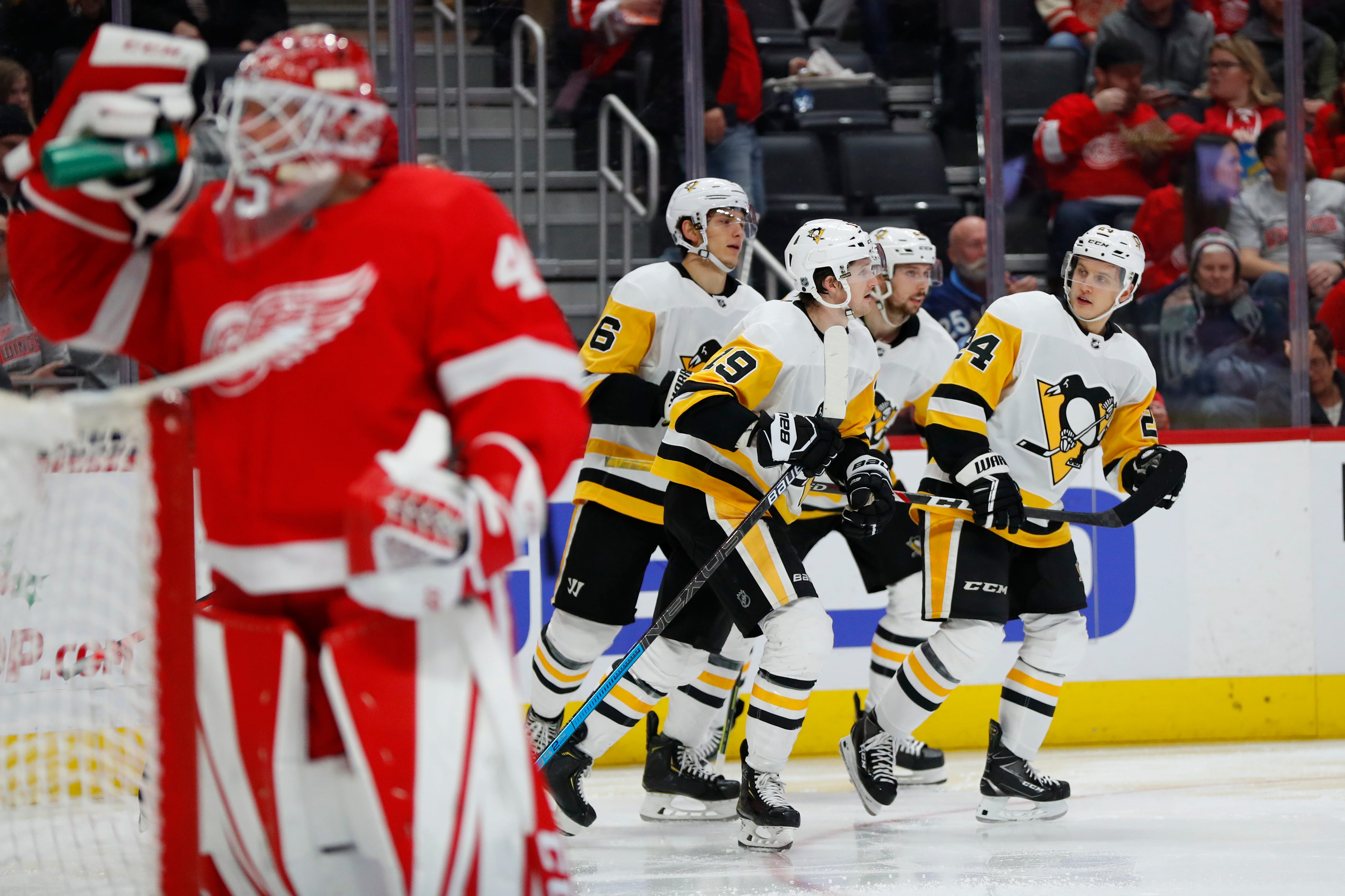 Pittsburgh Penguins center Dominik Kahun, right, celebrates his goal with teammates against the Detroit Red Wings in the third period.