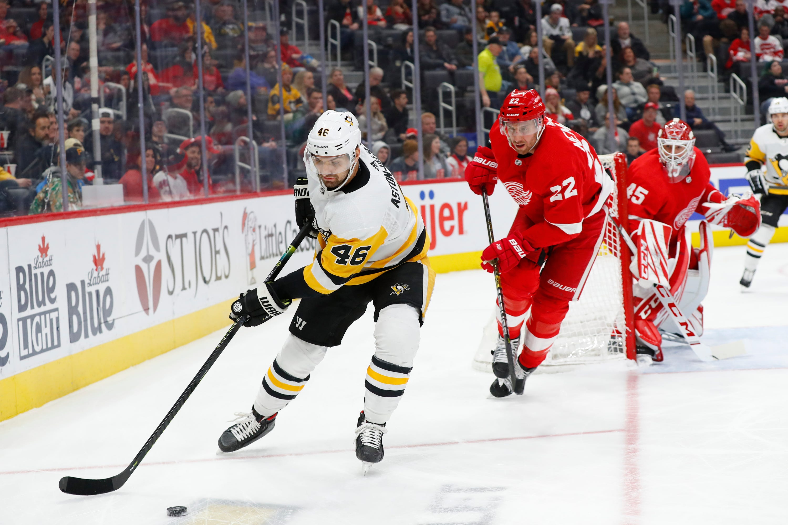 Pittsburgh Penguins center Zach Aston-Reese (46) collects the puck against the Detroit Red Wings in the first period.