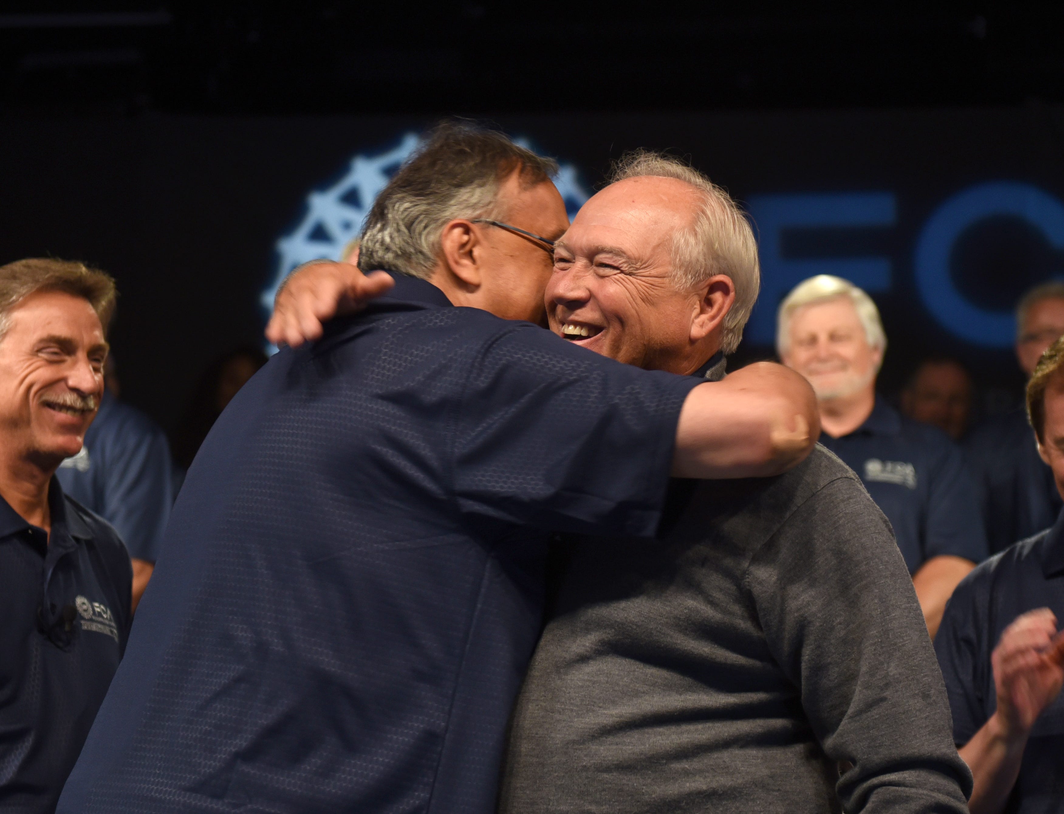 Fiat Chrysler CEO Sergio Marchionne, left, and UAW President Dennis Williams  embraced  at the start of contract talks in 2015. GM charges that Marchionne orchestrated a bribery conspiracy to corrupt three rounds of bargaining with the UAW in an effort to harm and take over Detroit's biggest automaker.