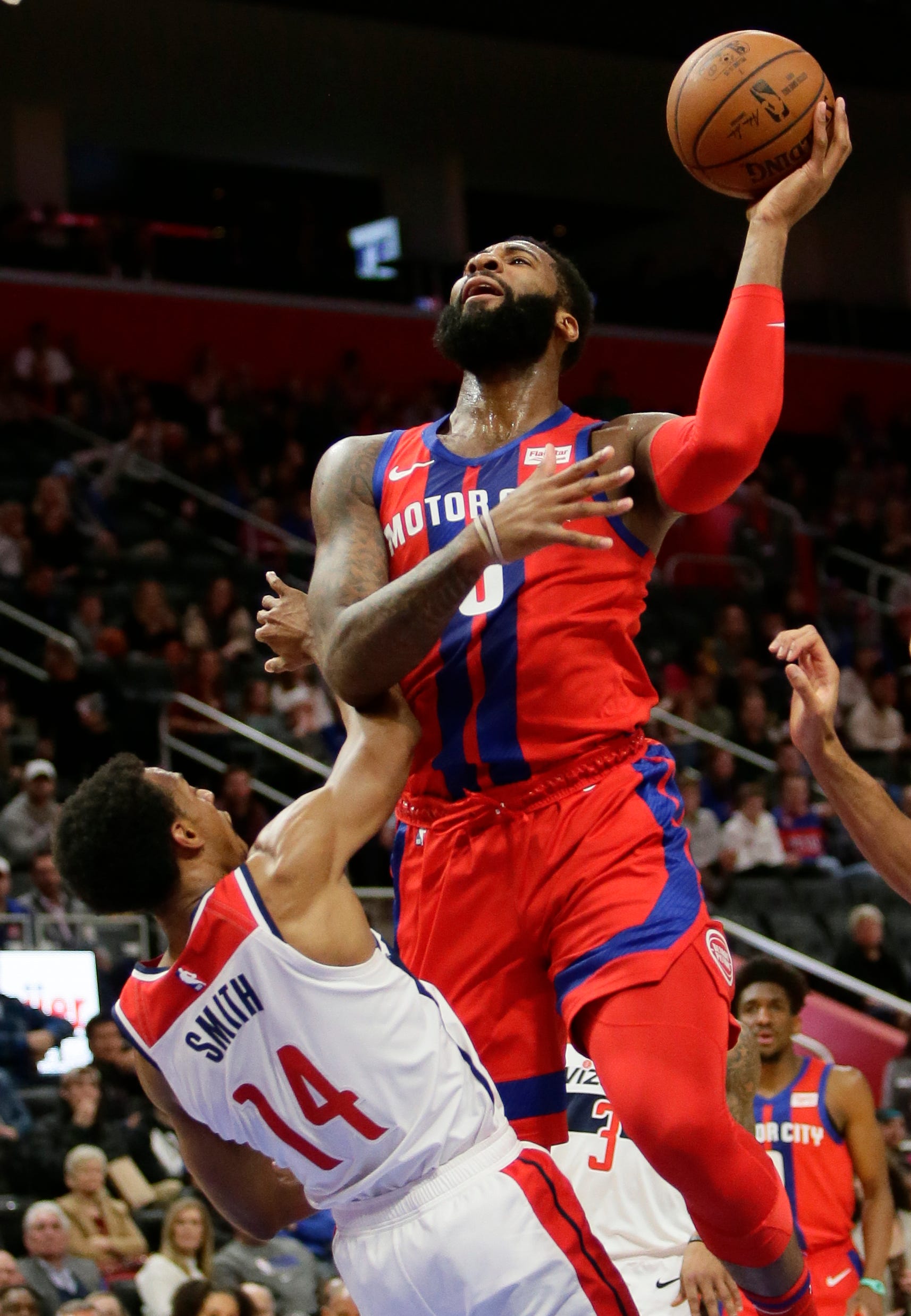 Detroit Pistons center Andre Drummond (0) shoots against Washington Wizards guard Ish Smith (14) during the first half on Thursday, Dec. 26, 2019, in Detroit.