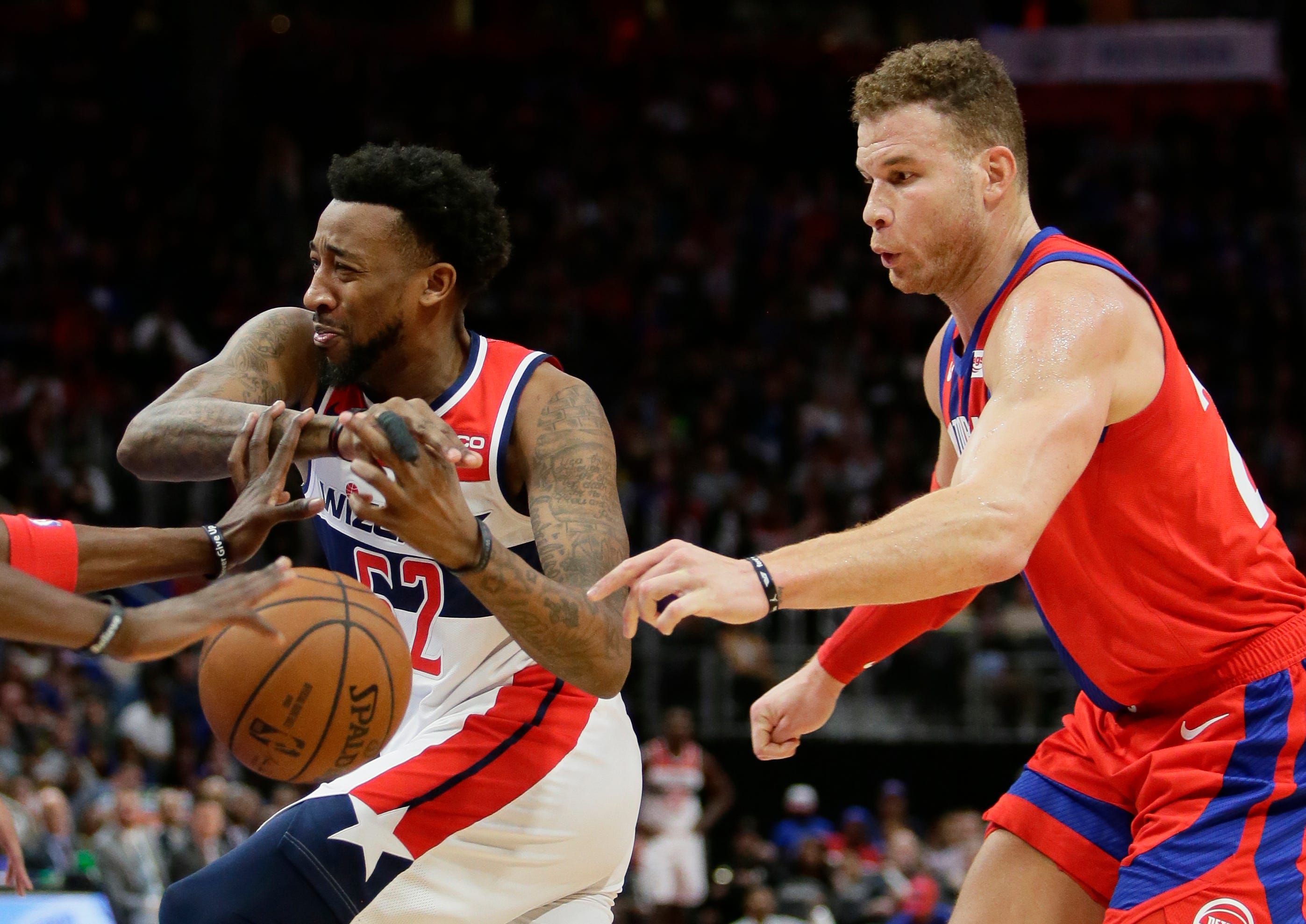 Washington Wizards guard Jordan McRae (52) has the ball knocked away by Detroit Pistons forward Blake Griffin, right, during the second half.