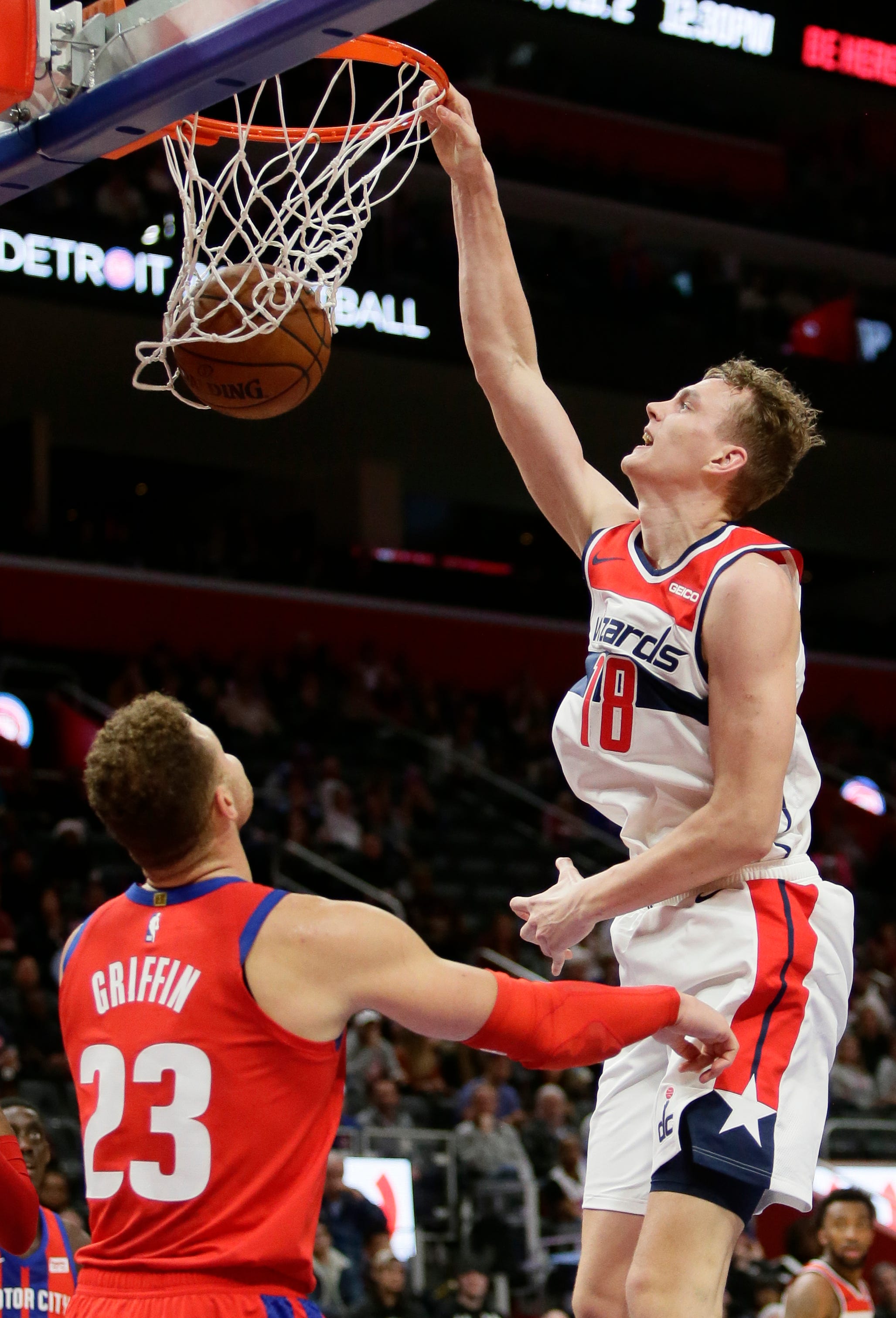 Washington wizards center Anzejs Pasecniks (18) dunks against Detroit Pistons forward Blake Griffin (23) during the second half.