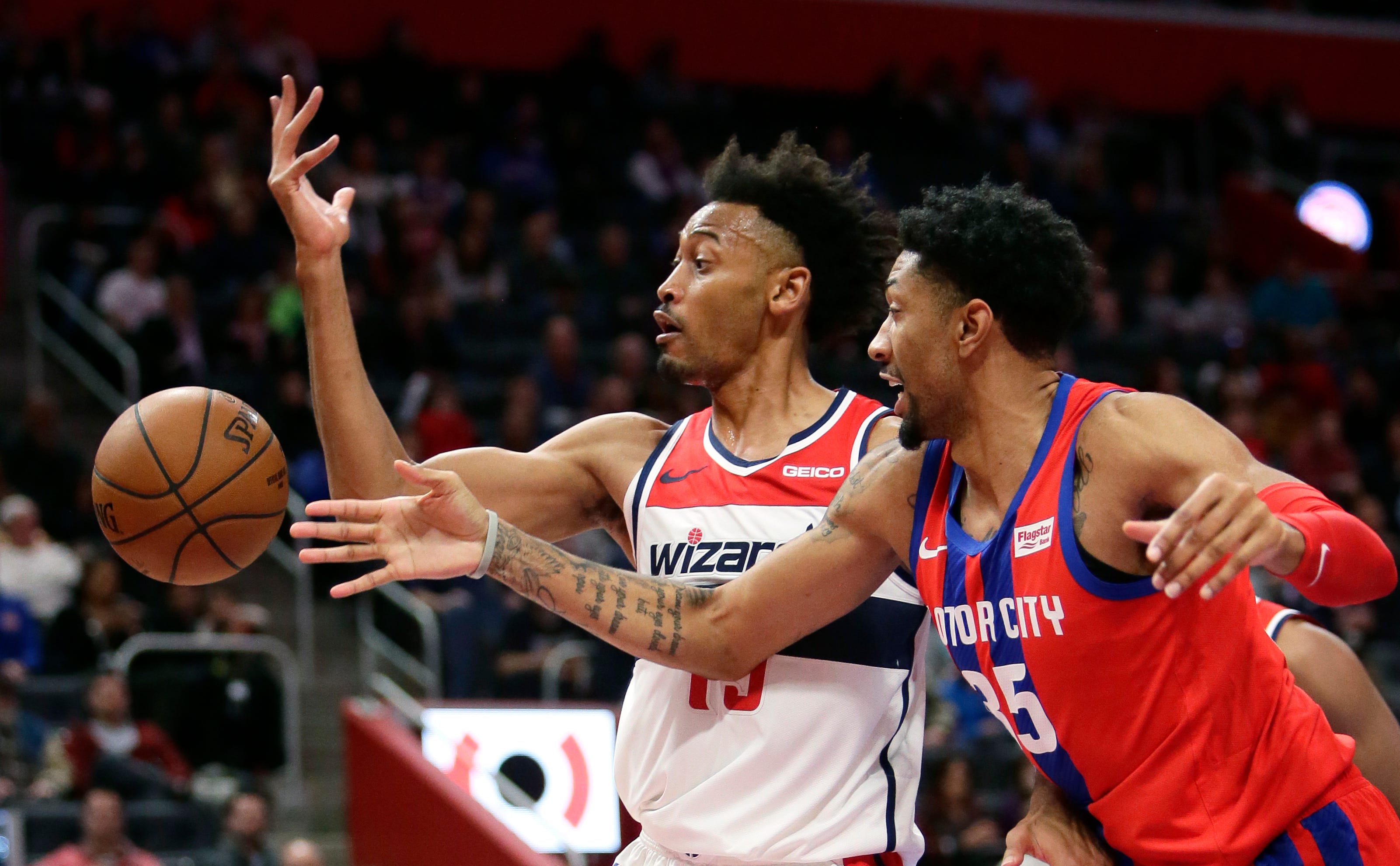 Washington Wizards forward Johnathan Williams, left, loses the ball against Detroit Pistons forward Christian Wood (35) during the second half.