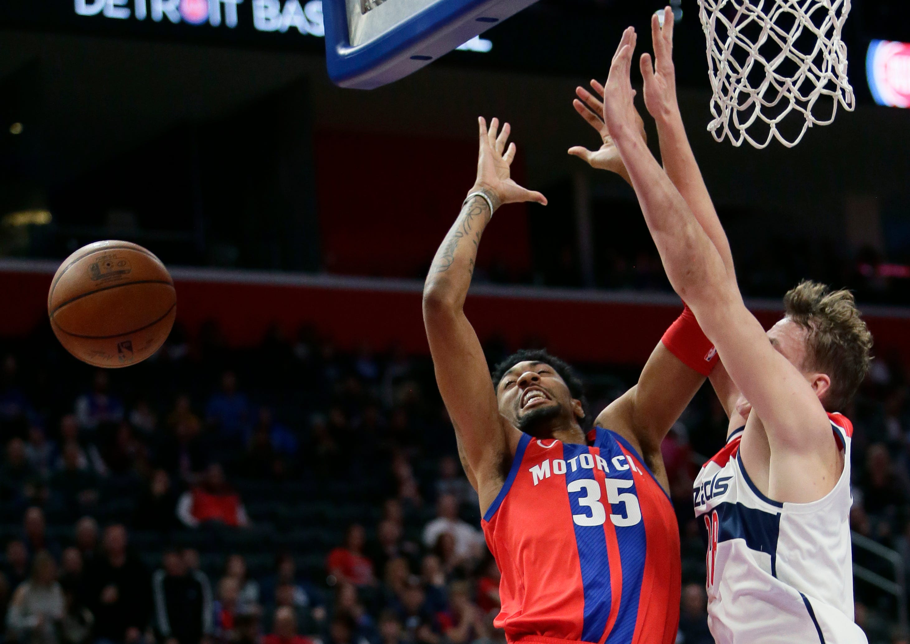 Detroit Pistons forward Christian Wood (35) has the ball knocked away by Washington Wizards center Anzejs Pasecniks during the first half.