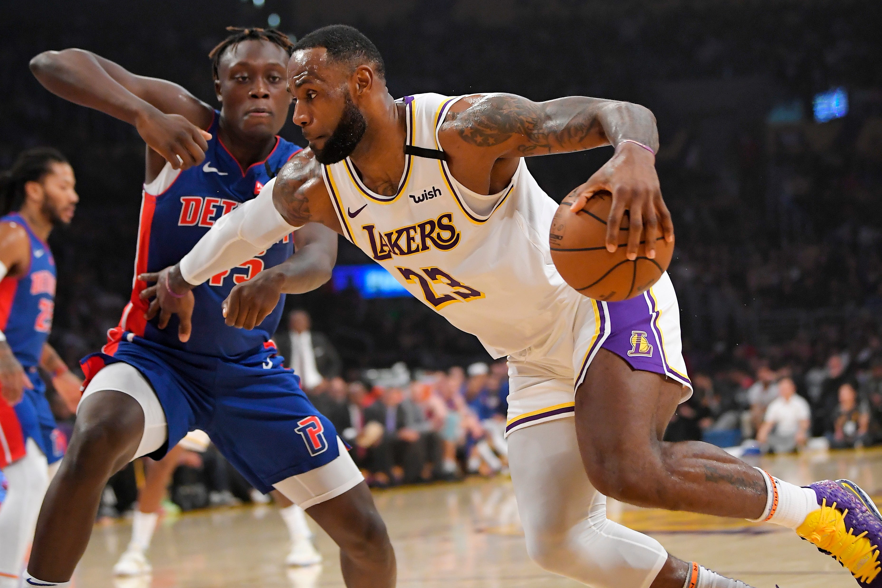 Los Angeles Lakers forward LeBron James, right, drives past Detroit Pistons forward Sekou Doumbouya during the first half.
