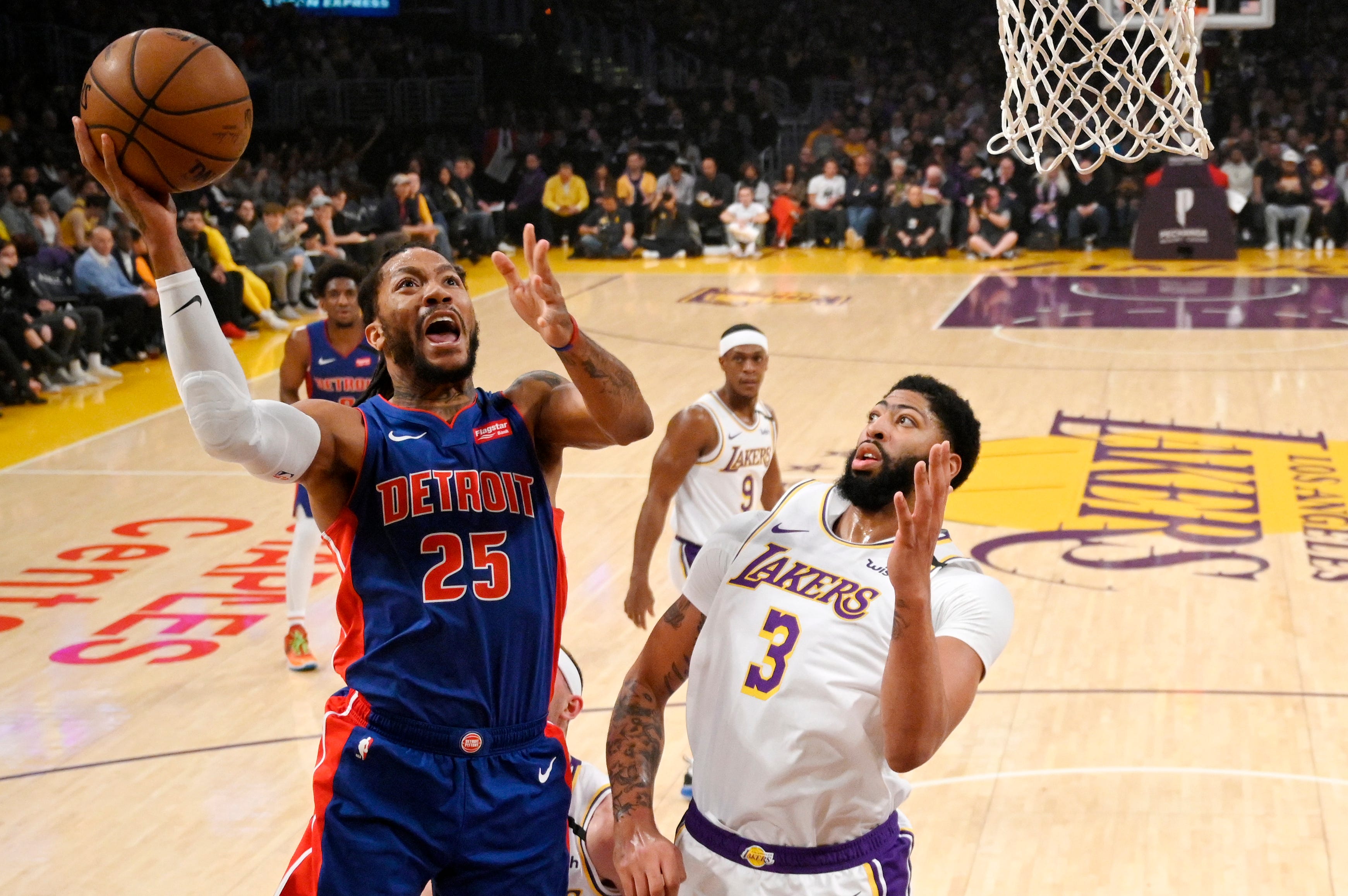 Detroit Pistons guard Derrick Rose, left, shoots as Los Angeles Lakers forward Anthony Davis defends during the first half of an NBA basketball game Sunday, Jan. 5, 2020, in Los Angeles.