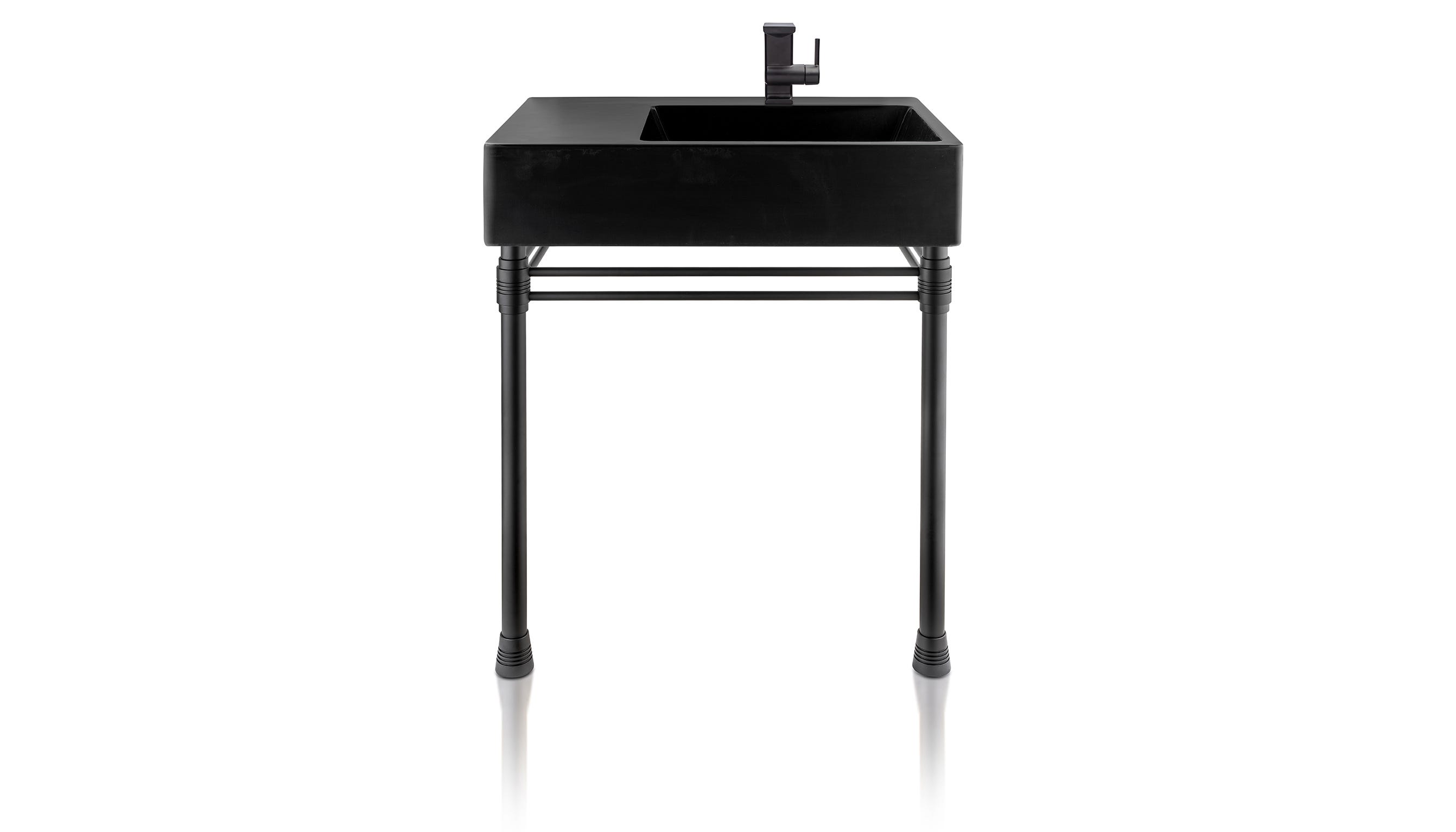 An asymmetrical sink with an industrial look is a striking silhouette in matte black. The Escondido Vanity from Thompson Traders has an off-center design that offers additional counter space. Its sleek shape is elegance and grace in harmony. This is a new matte black finish from Thompson Traders, created by expert coppersmiths in Santa Clara del Cobre, Mexico. It complements popular design trends today.