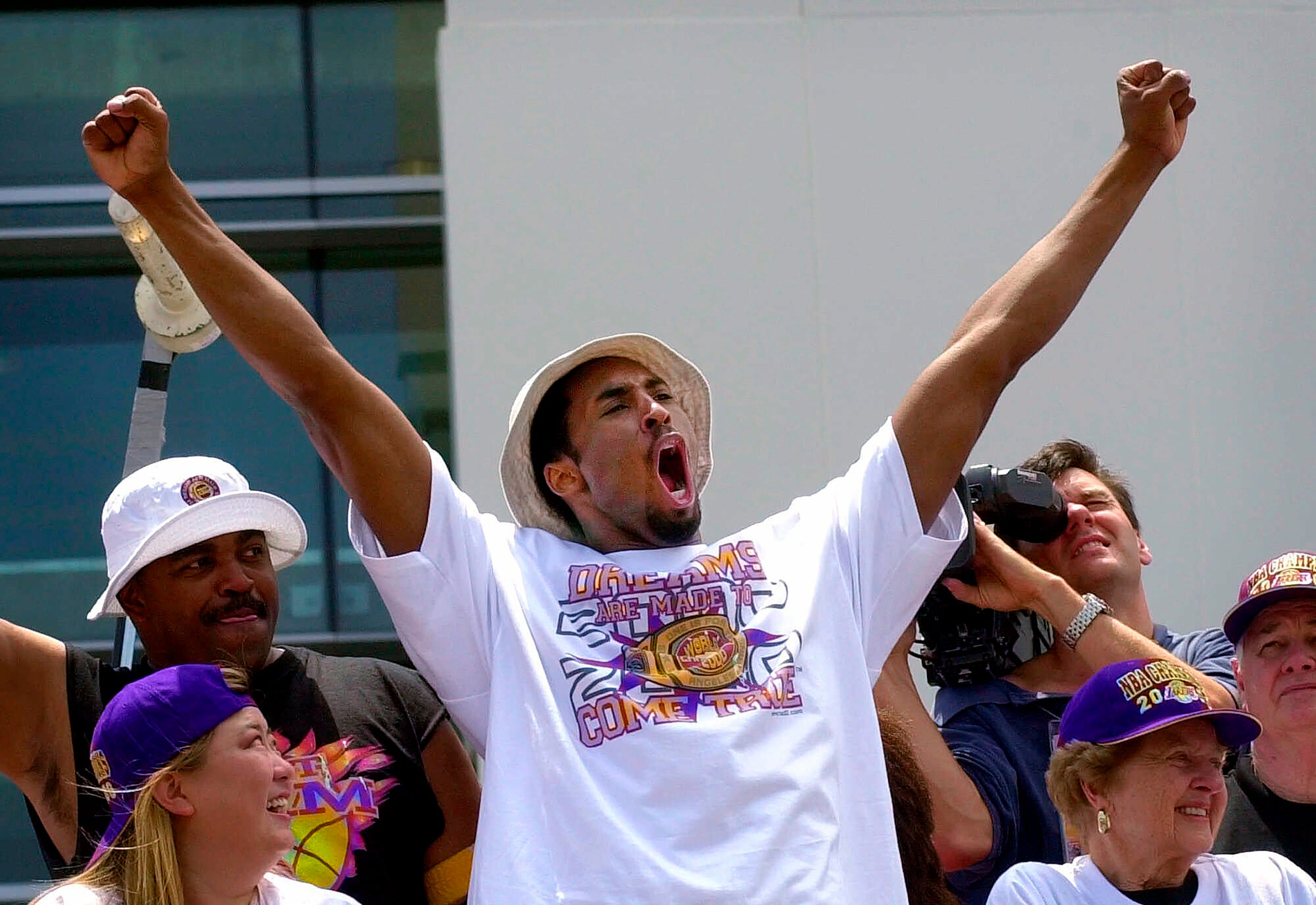 Kobe Bryant celebrates the 2000 NBA championship during a parade June 21 of that year.
