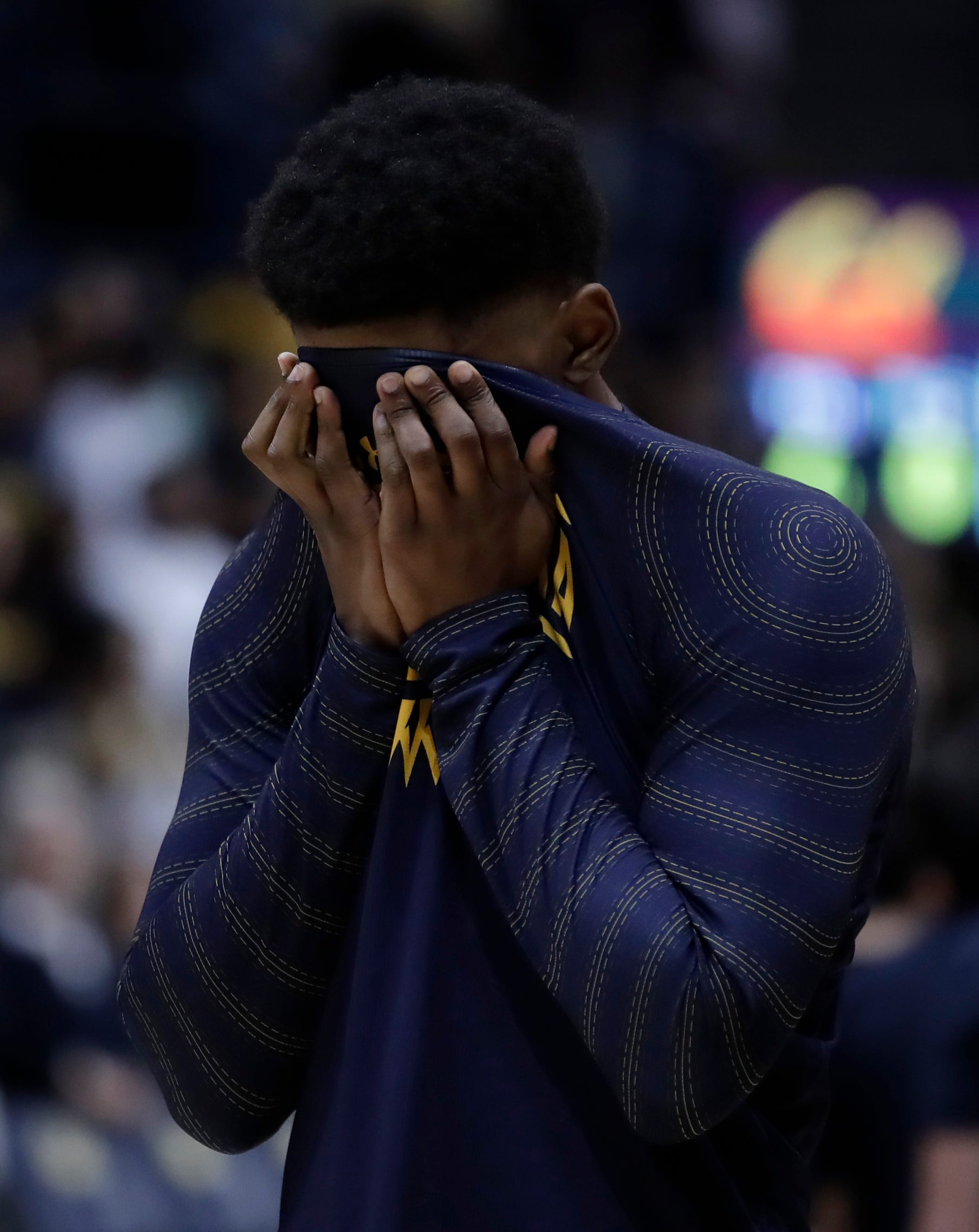 California's D.J. Thorpe covers his face during a moment of silence for Kobe Bryant.
