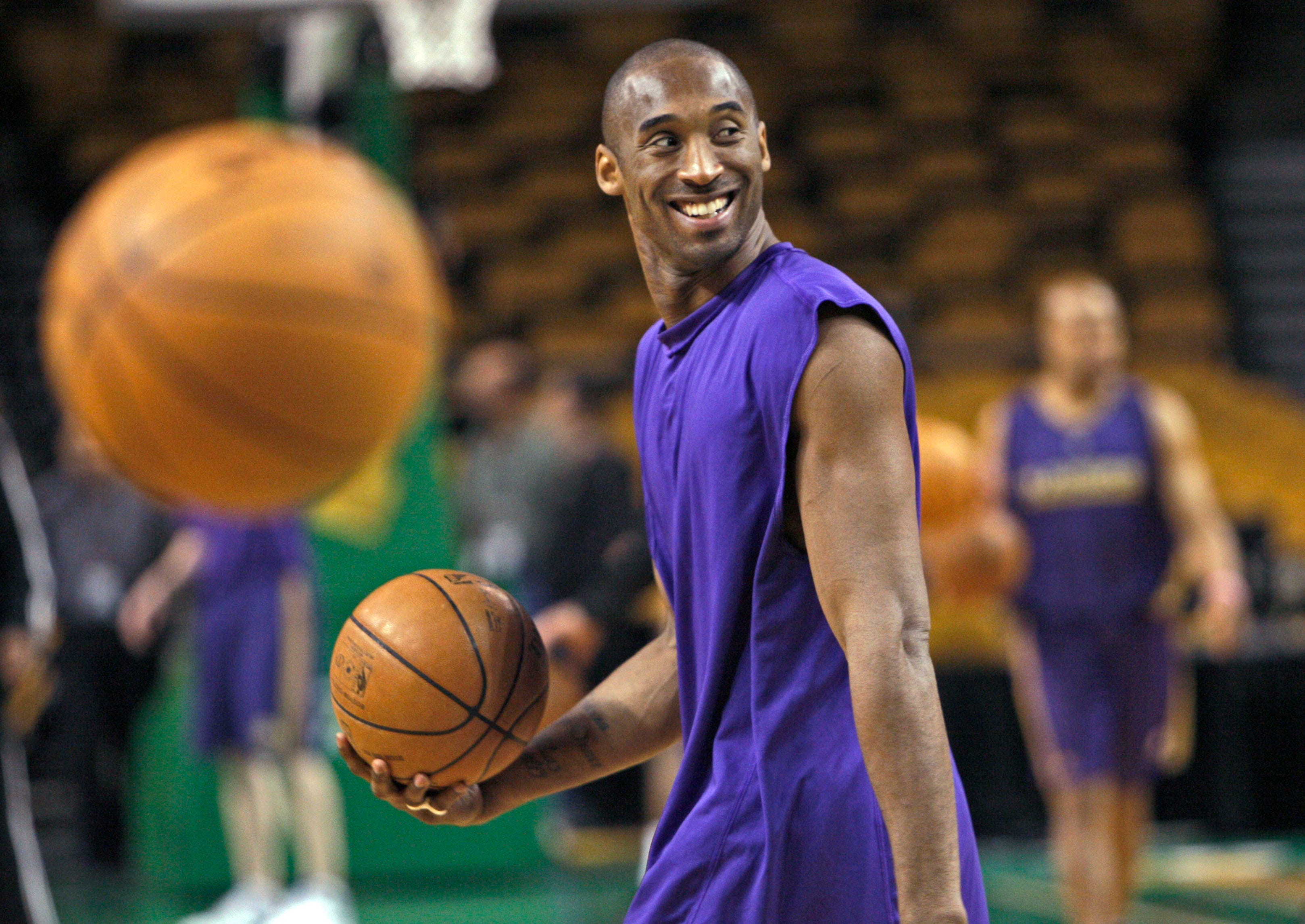 Kobe Bryant laughs with his teammates during practice in 2008.