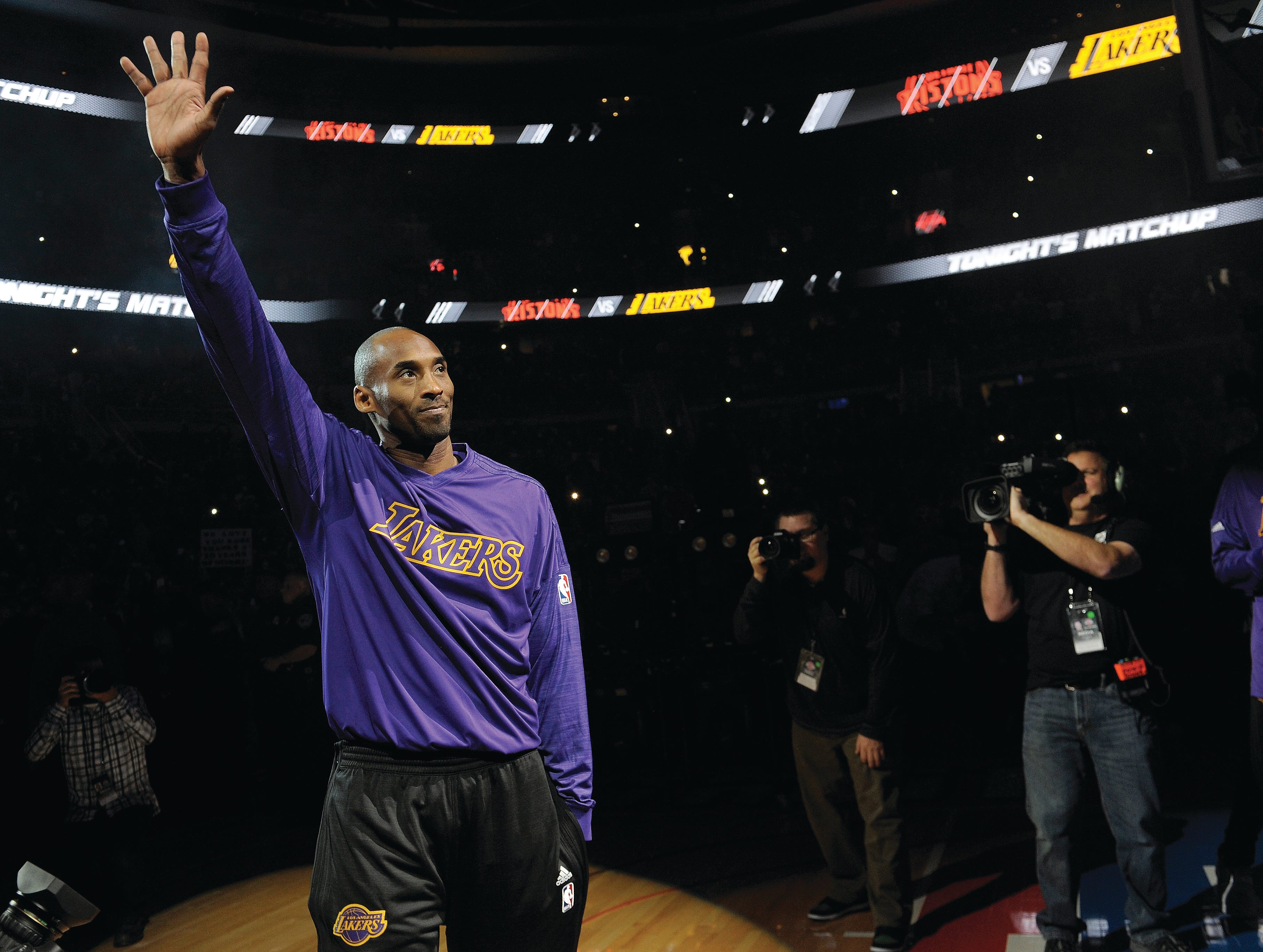 Lakers' Kobe Bryant waves to the fans during pregame introductions at The Palace as he makes his retirement tour in 2015. Bryant was killed in a helicopter crash Sunday, Jan. 26, 2020. He was 41.