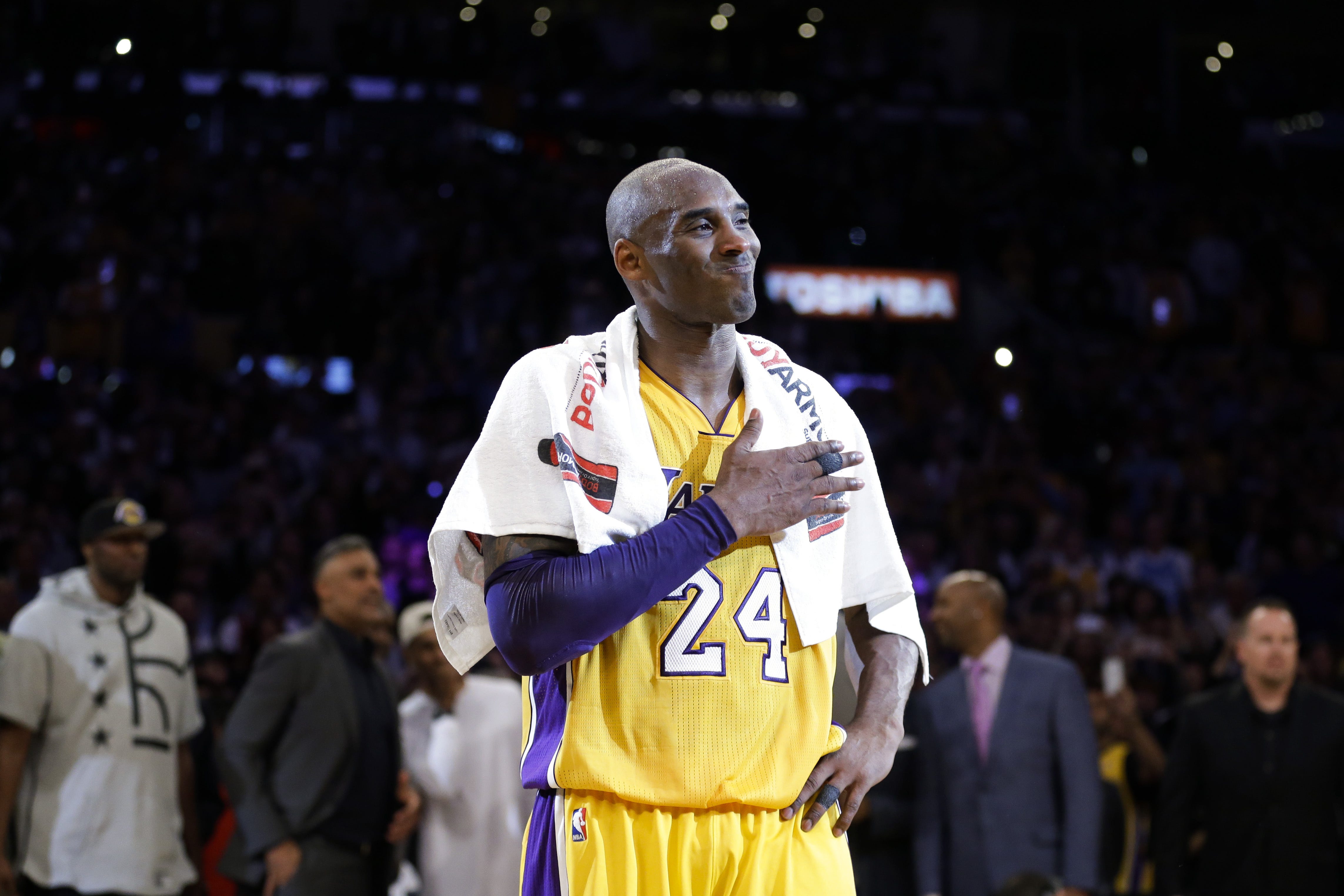 Kobe Bryant pounds his chest after the last NBA game of his career on April 13, 2006.