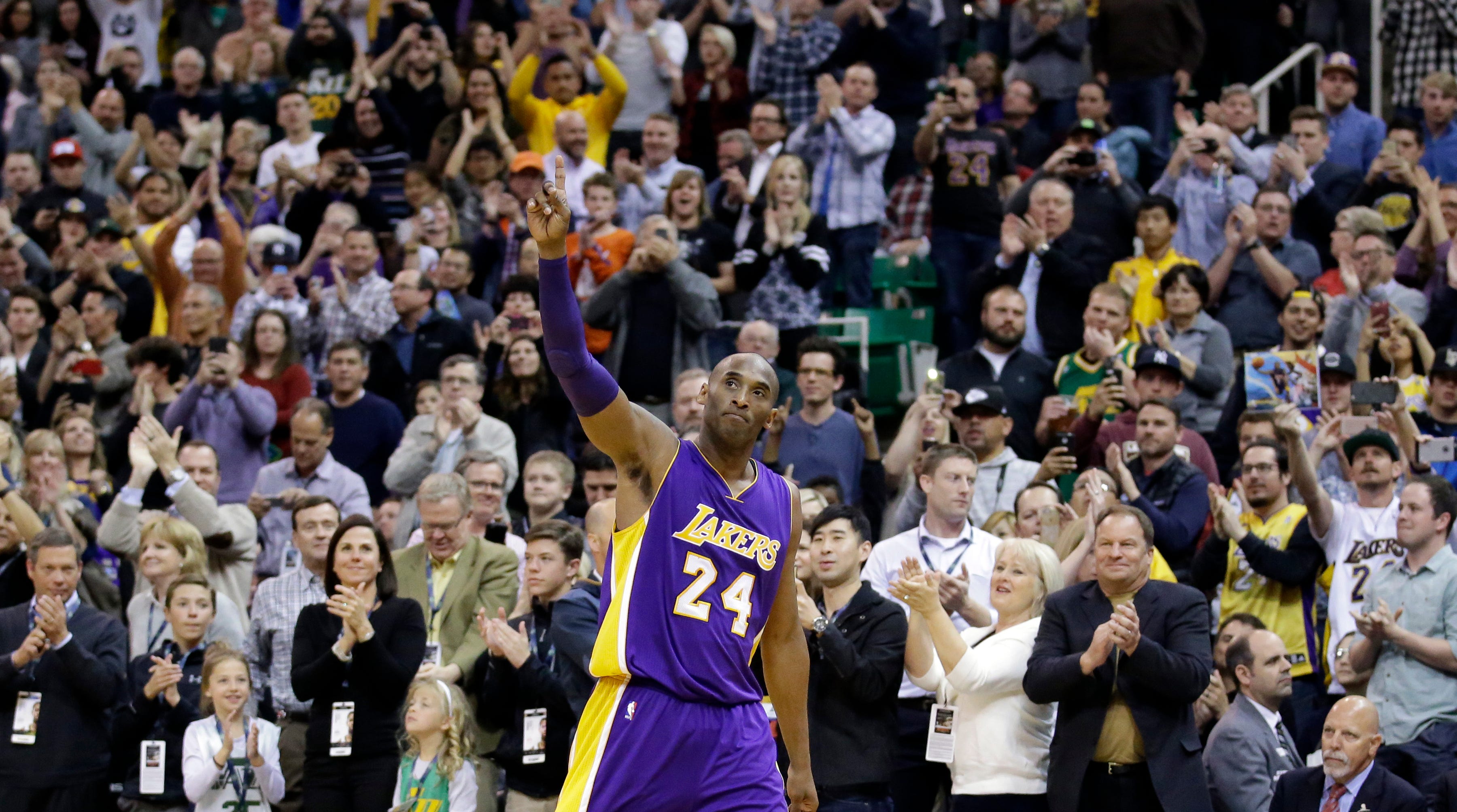 Kobe Bryant wavevs to the crowd after walking off the court in Salt Lake City in 2015.