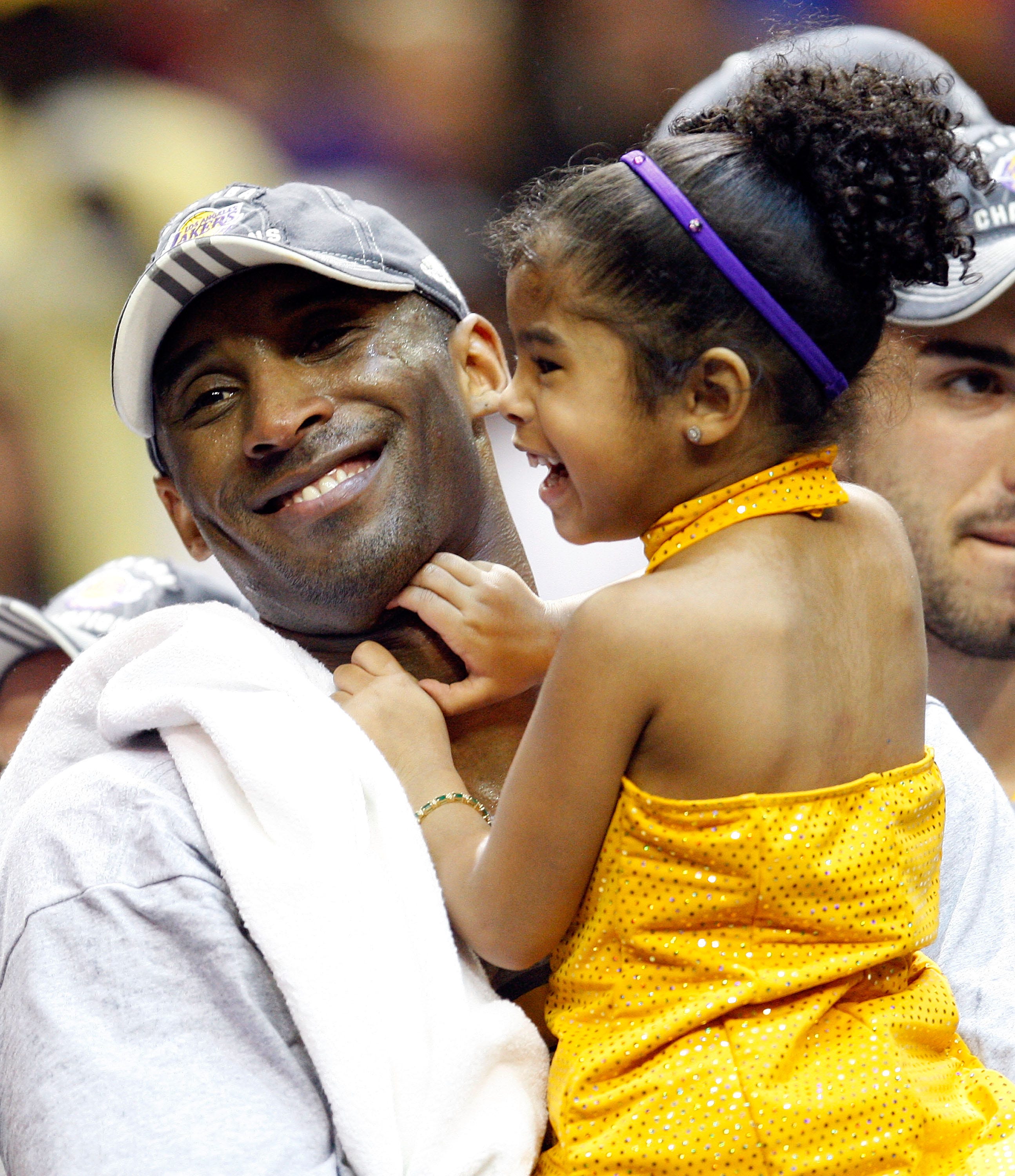 Kobe Bryant holds his daughter, Gianna, after winning the 2009 NBA Finals.