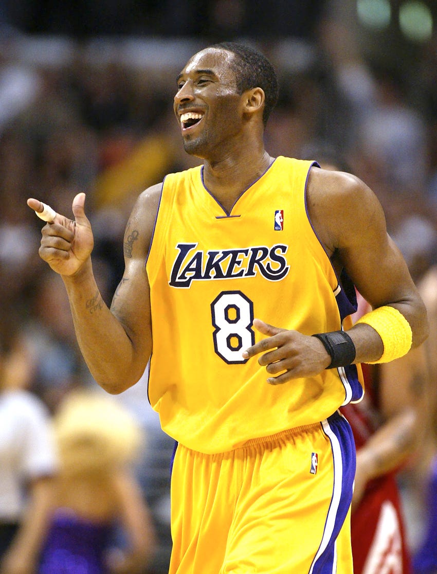 Kobe Bryant reacts after making a basket in the second half against the Houston Rockets during Game 2 of the first round of the NBA playoffs in 2004.