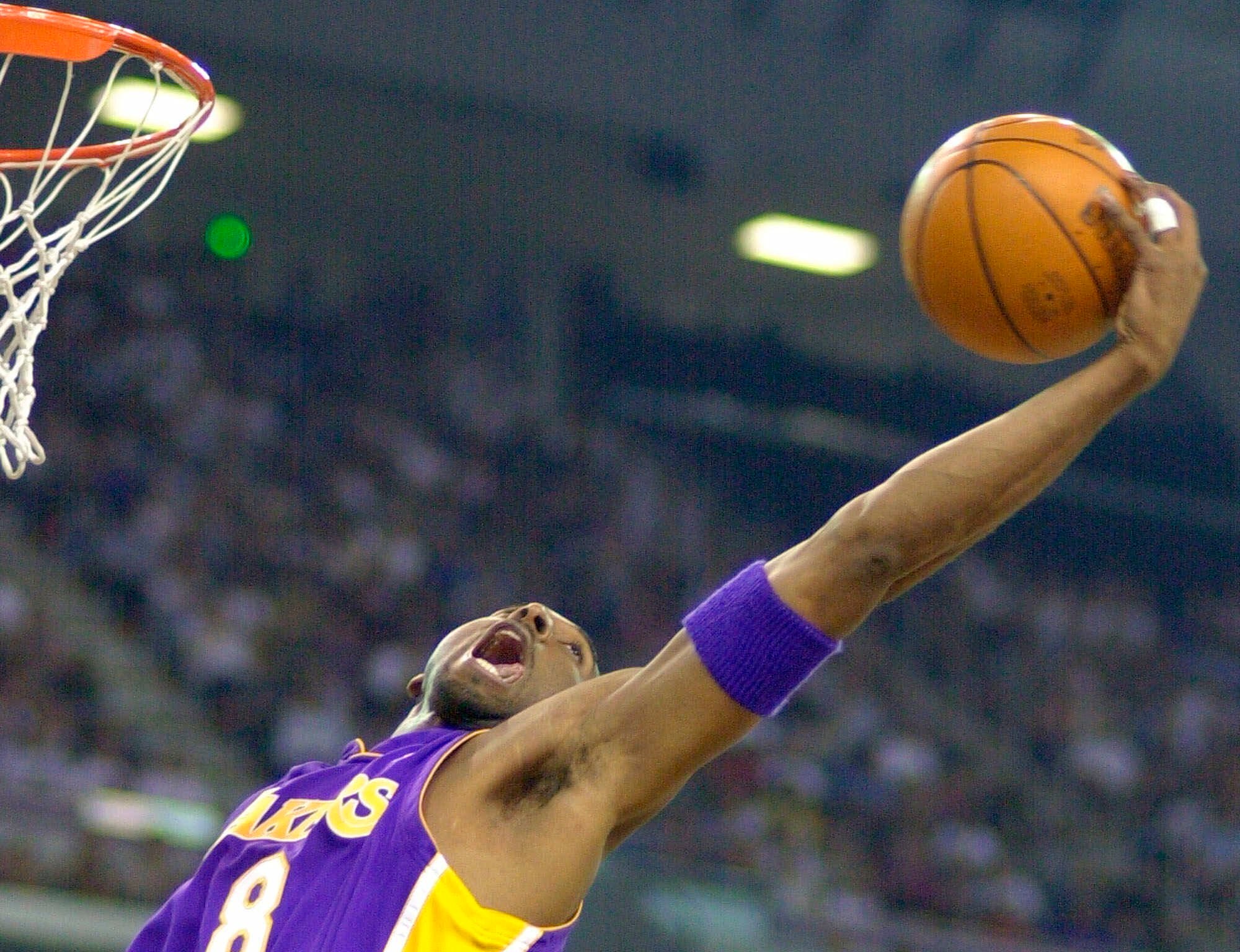 Kobe Bryant reaches back for a rebound in 2001.