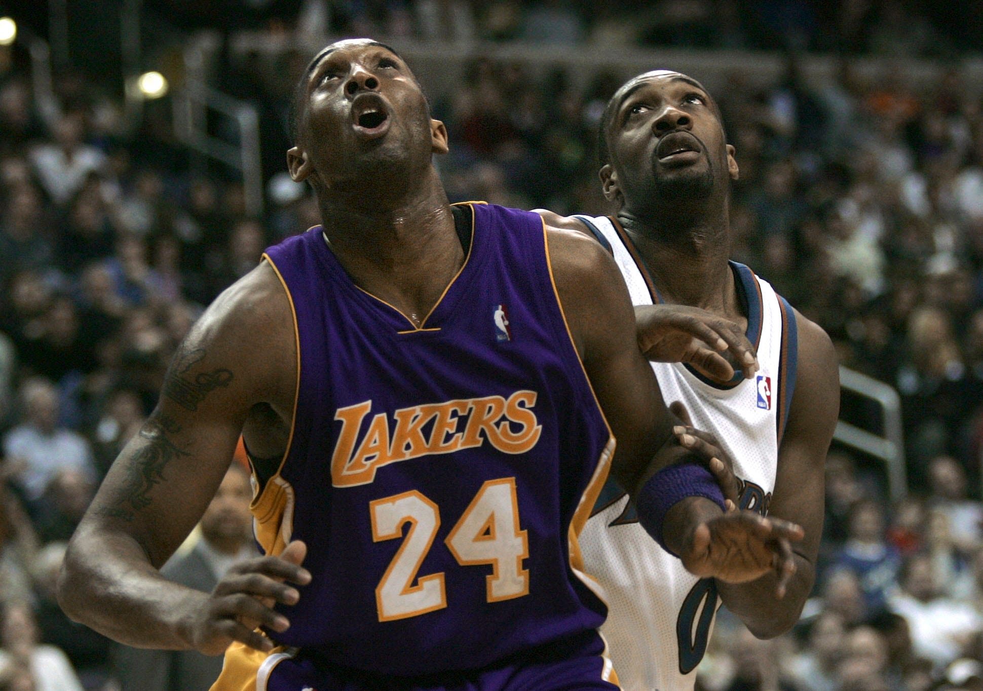 Washington's Gilbert Arenas, right, and Kobe Bryant look for a rebound during the fourth quarter of a game in 2007.