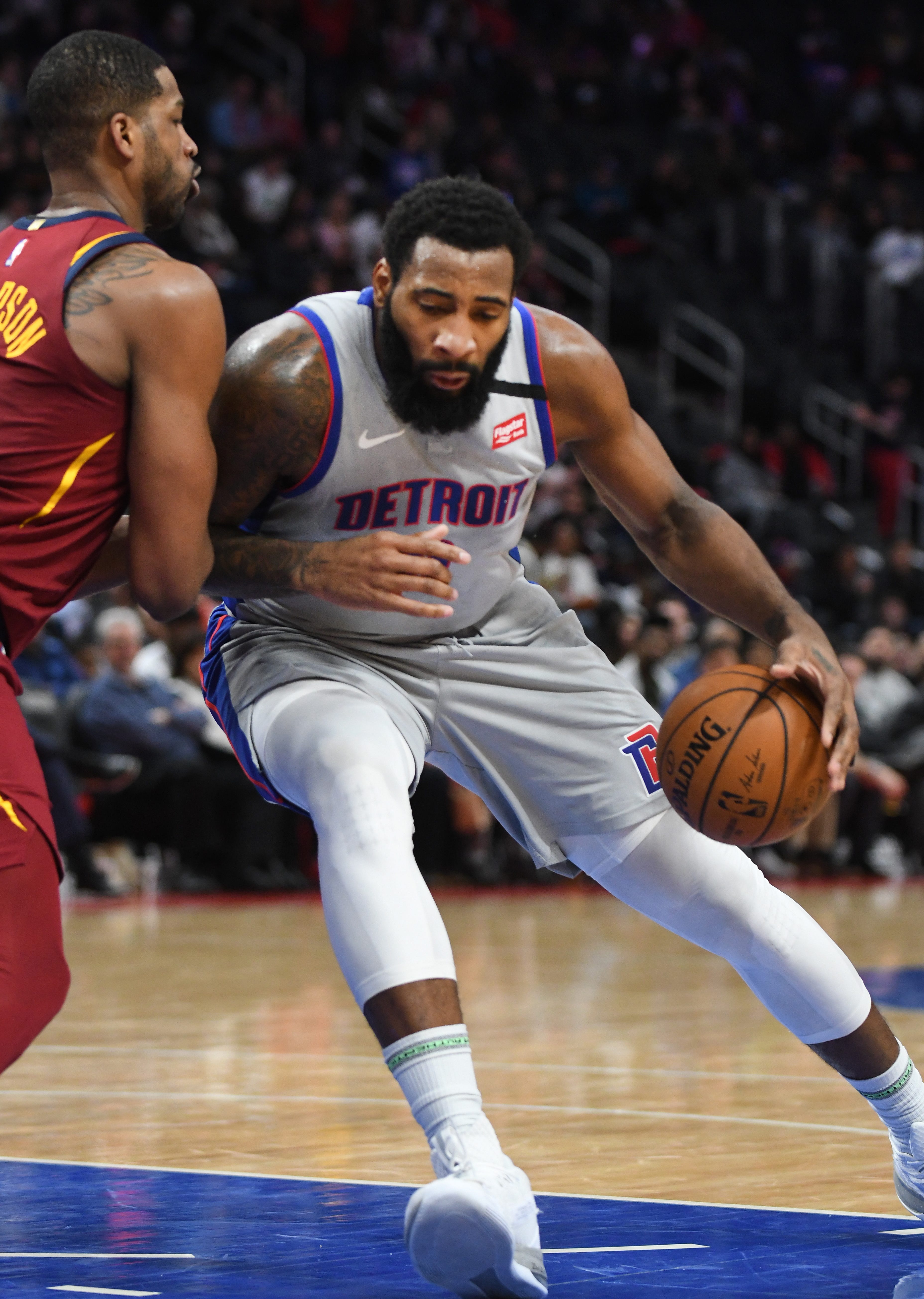 Pistons' Andre Drummond works against Cavaliers' Tristan Thompson in the second quarter.