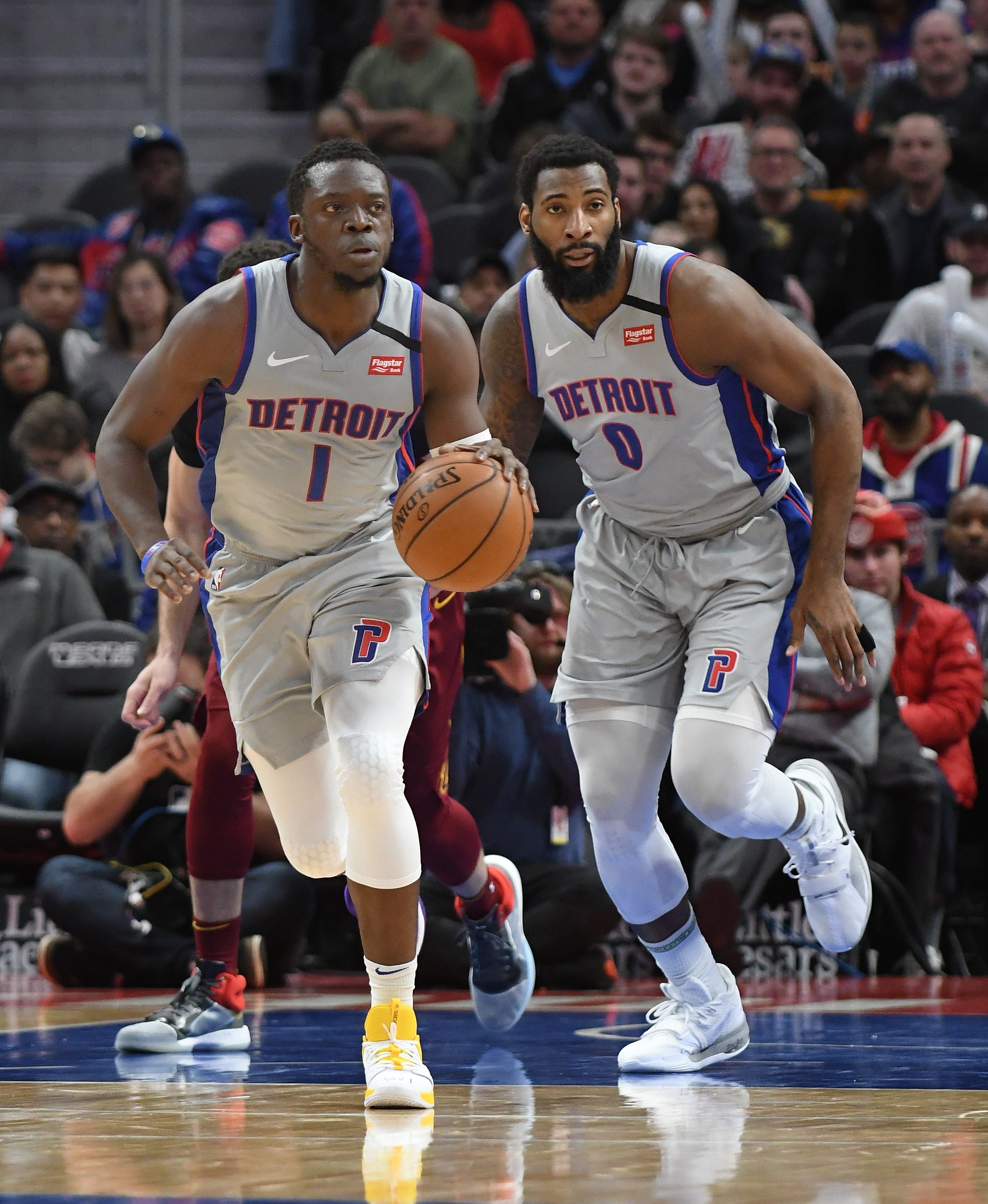 Pistons Reggie Jackson and Andre Drummond bring the ball up court in the second quarter.