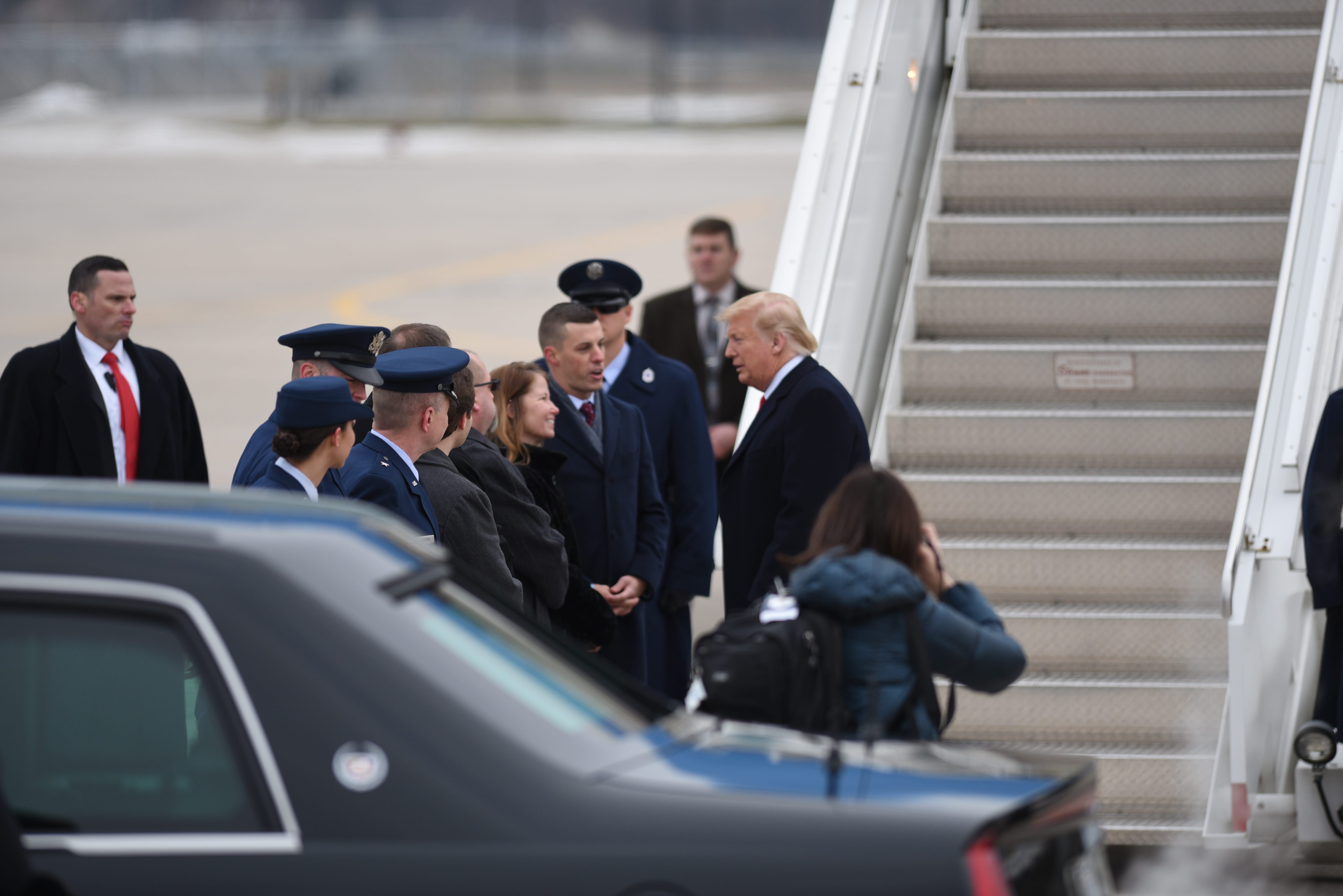 President Donald Trump meets with Speaker of the House Lee Chatfield upon arrival at Selfridge Air Base in Harrison Township on Thursday, Jan. 30, 2020.