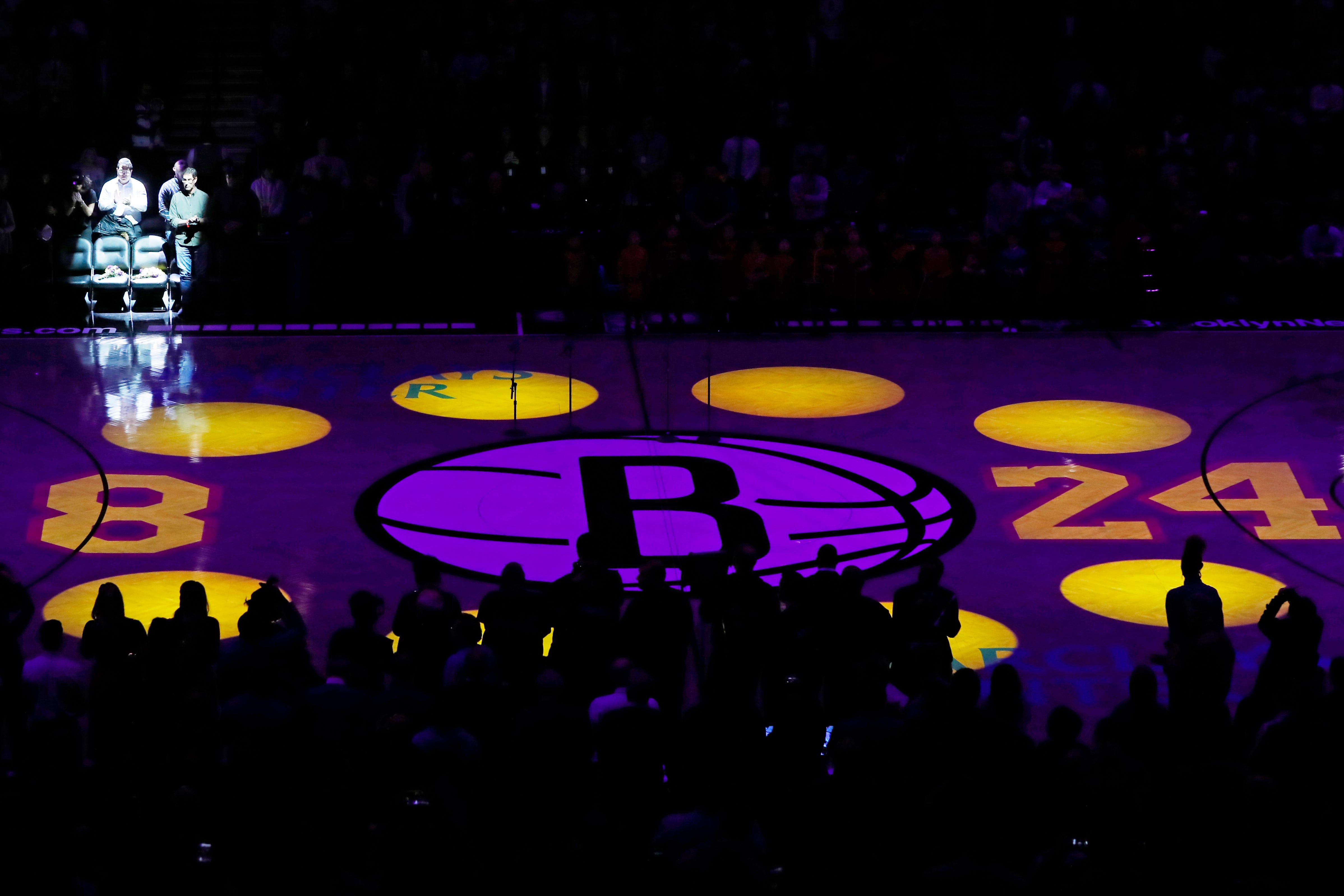 Flowers are placed on empty chairs that retired Los Angeles Lakers superstar Kobe Bryant and his daughter Gianna occupied Dec. 21, 2019, when they attended a Brooklyn Nets game at the Barclays Center during a pregame tribute to Byant before an NBA basketball game between the Nets and the Detroit Pistons, Wednesday, Jan. 29, 2020, in New York.