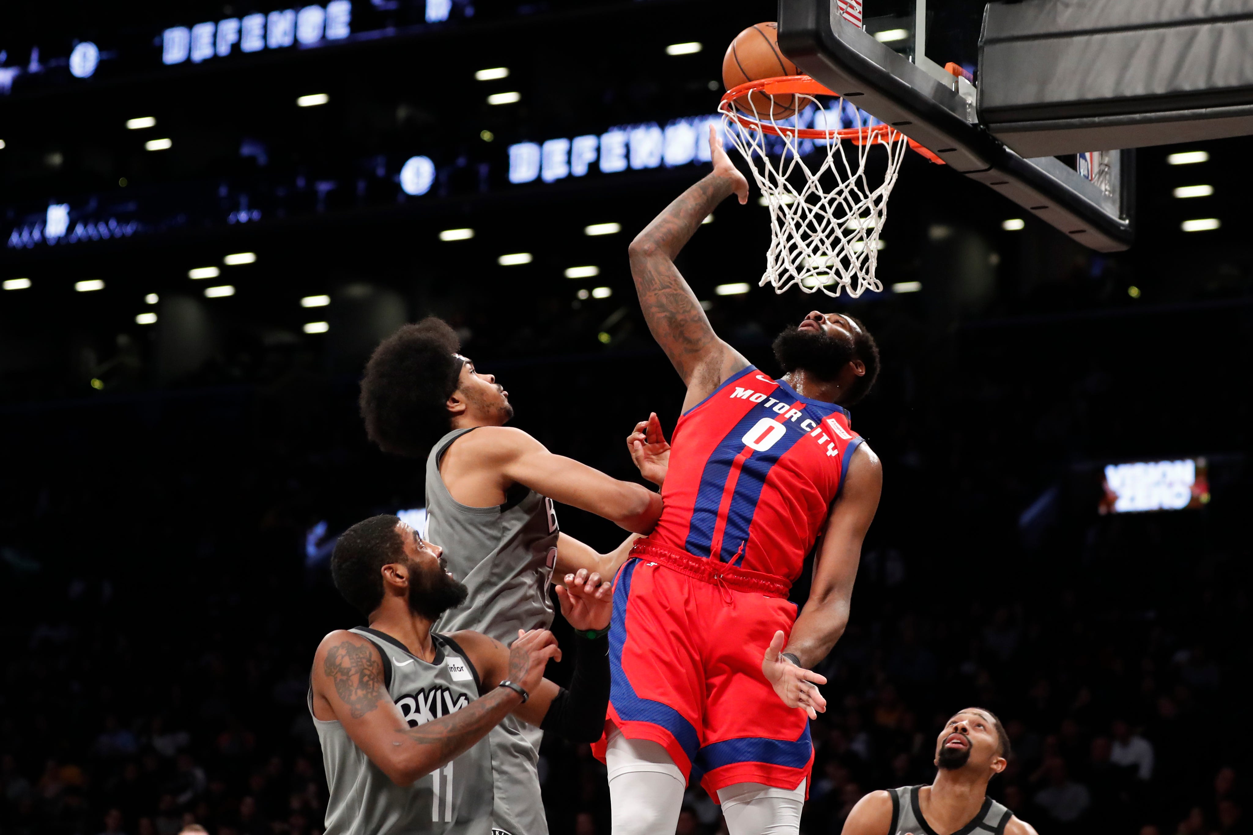 Brooklyn Nets center Jarrett Allen watches as Detroit Pistons center Andre Drummond tips the ball into the net during the first half.