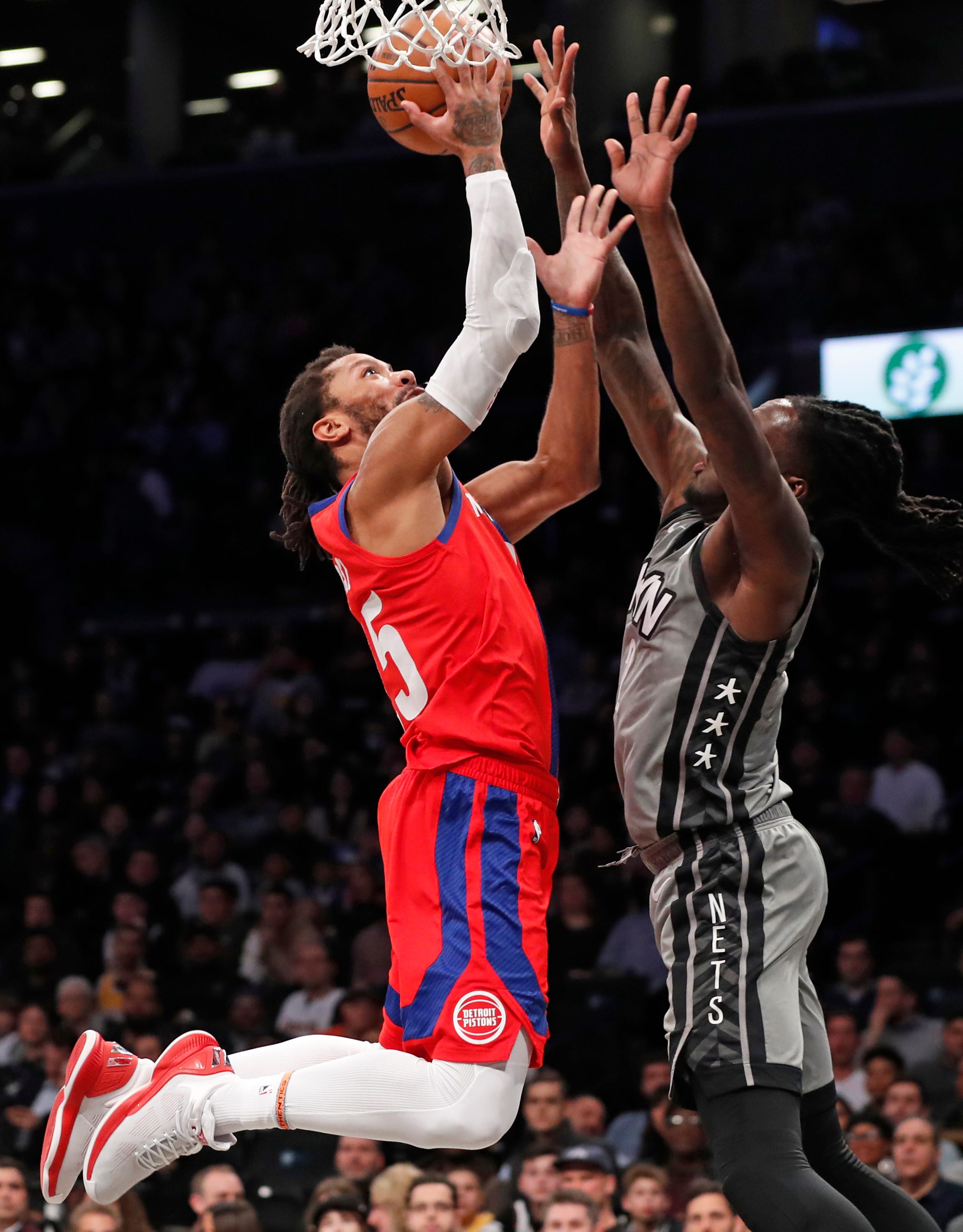 Detroit Pistons guard Derrick Rose goes up against Brooklyn Nets forward Taurean Prince during the first half.