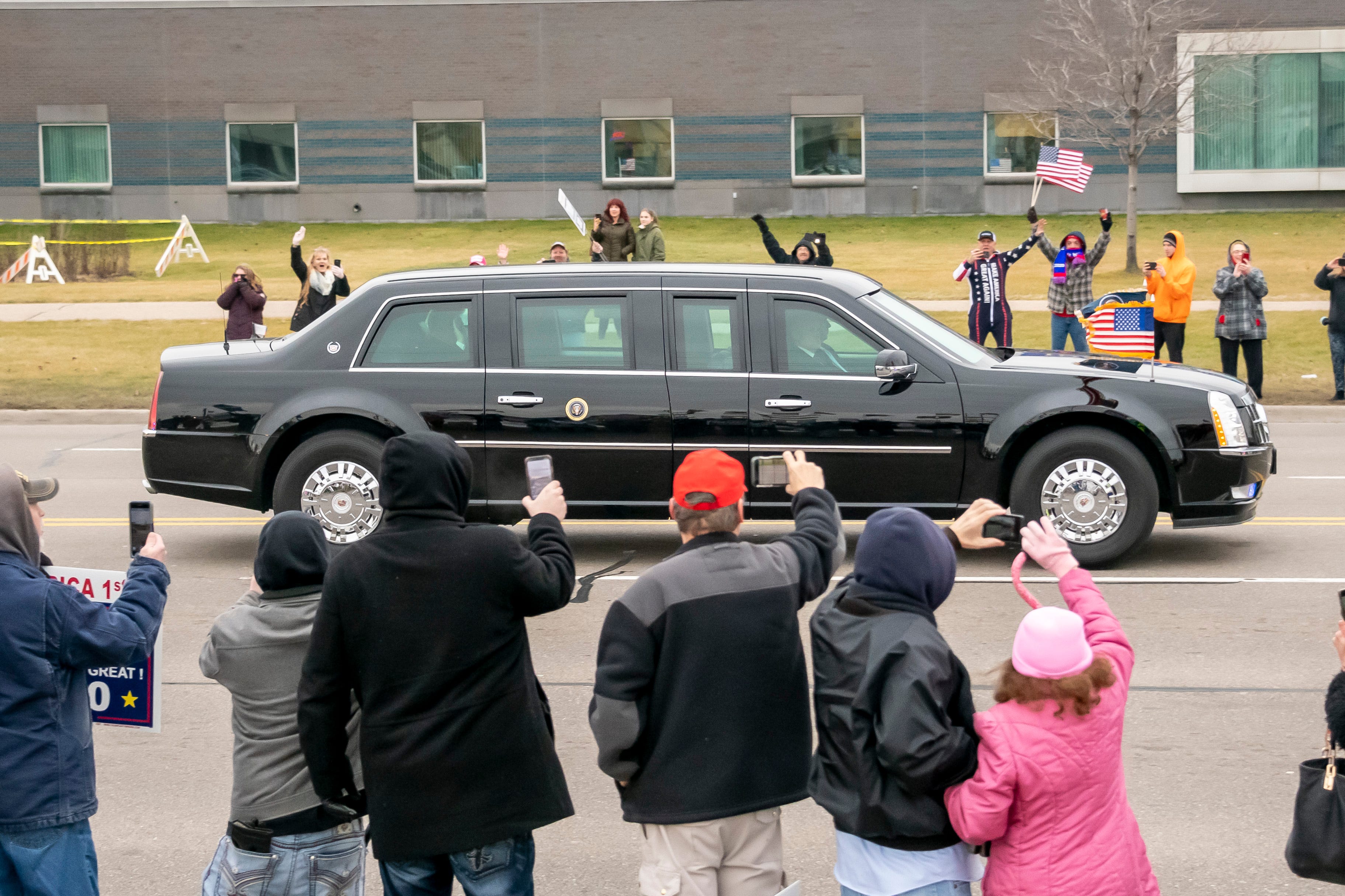President Donald Trump's motorcade passes supporters along Van Dyke in Warren on Jan. 30, 2020.