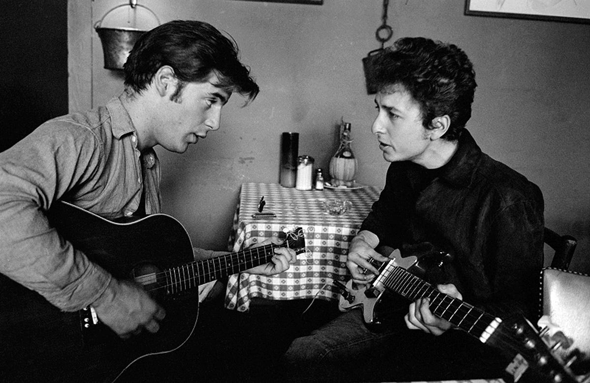 Bob Dylan and John Sebastian jammin' at Cafe Espresso, Woodstock, NY 1964.