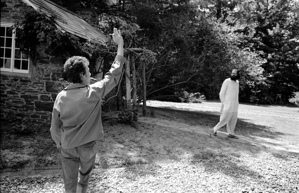 Bob Dylan waving to Allen Ginsberg in his yard at home in Woodstock, NY 1964.