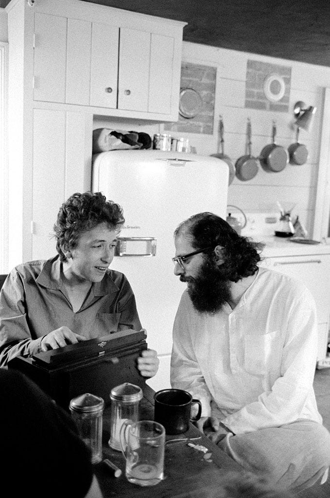 Bob Dylan & Allen GInsberg singing and playing the harmonium in the kitchen, Woodstock, NY, 1964.