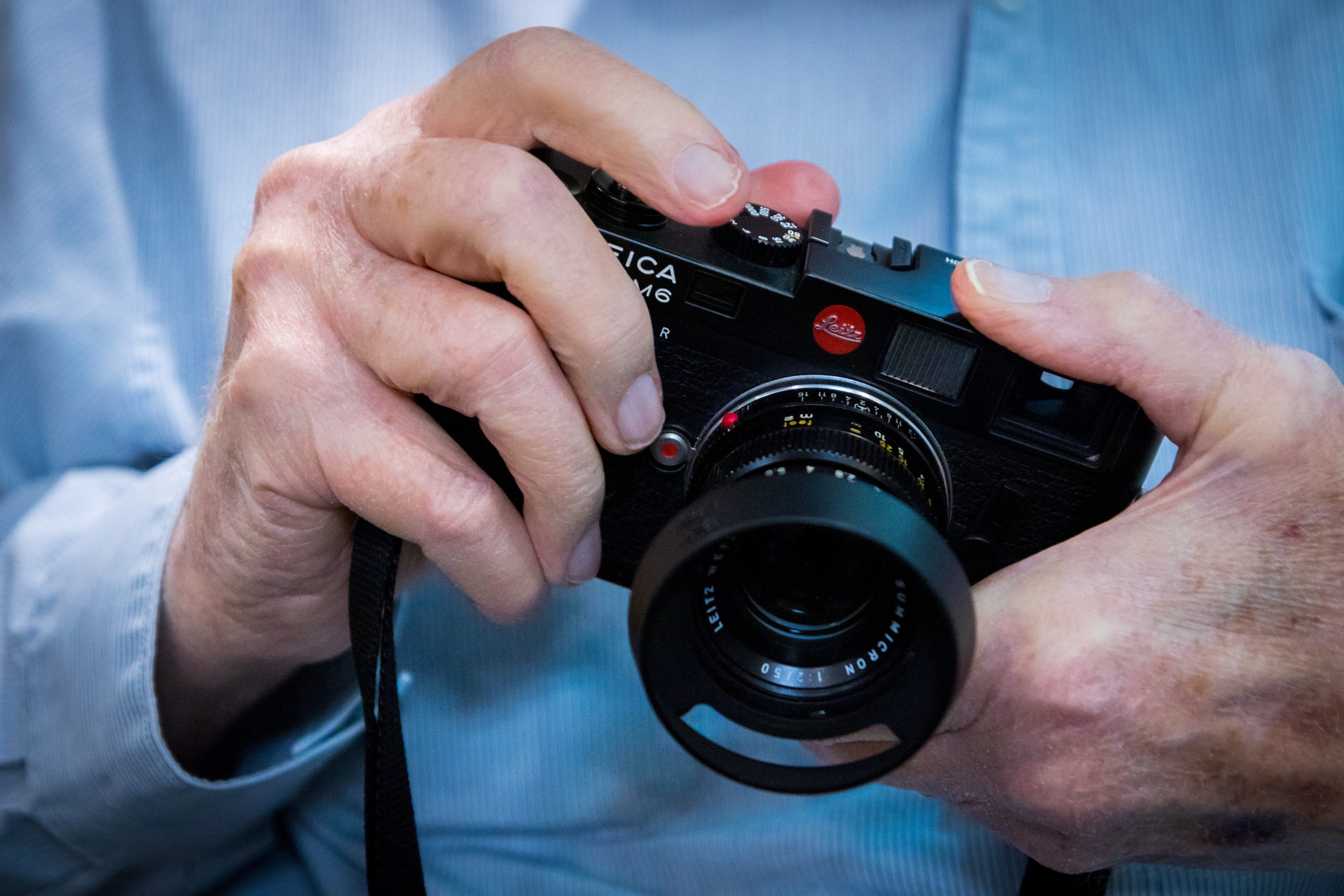 Photographer Douglas R. Gilbert holds his Leica M6 camera at his home in Grand Haven, Michigan.