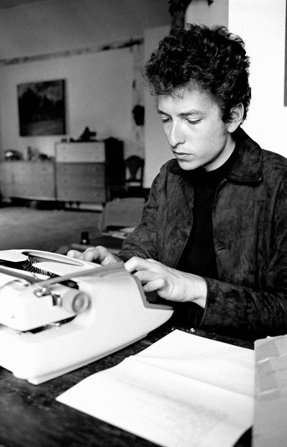 Bob Dylan working in the writing room above Cafe Espresso, Woodstock, NY 1964.